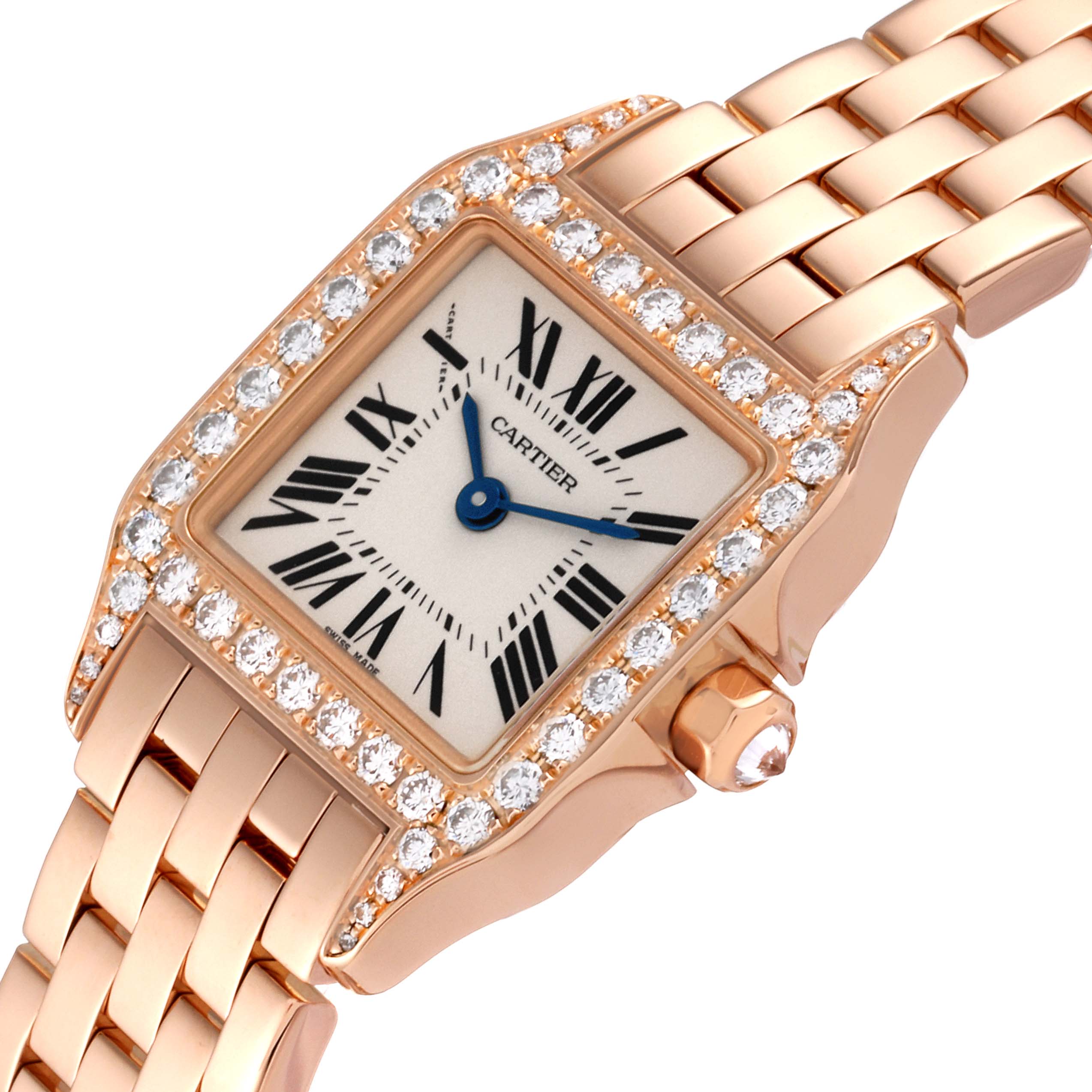 The image shows a close-up of the Cartier Santos Demoiselle WF9011Z8 Women's Rose Gold Silver Dial WF9011Z8 Women's Rose Gold Silver Dial watch face and part of the bracelet, viewed from a slight angle.
