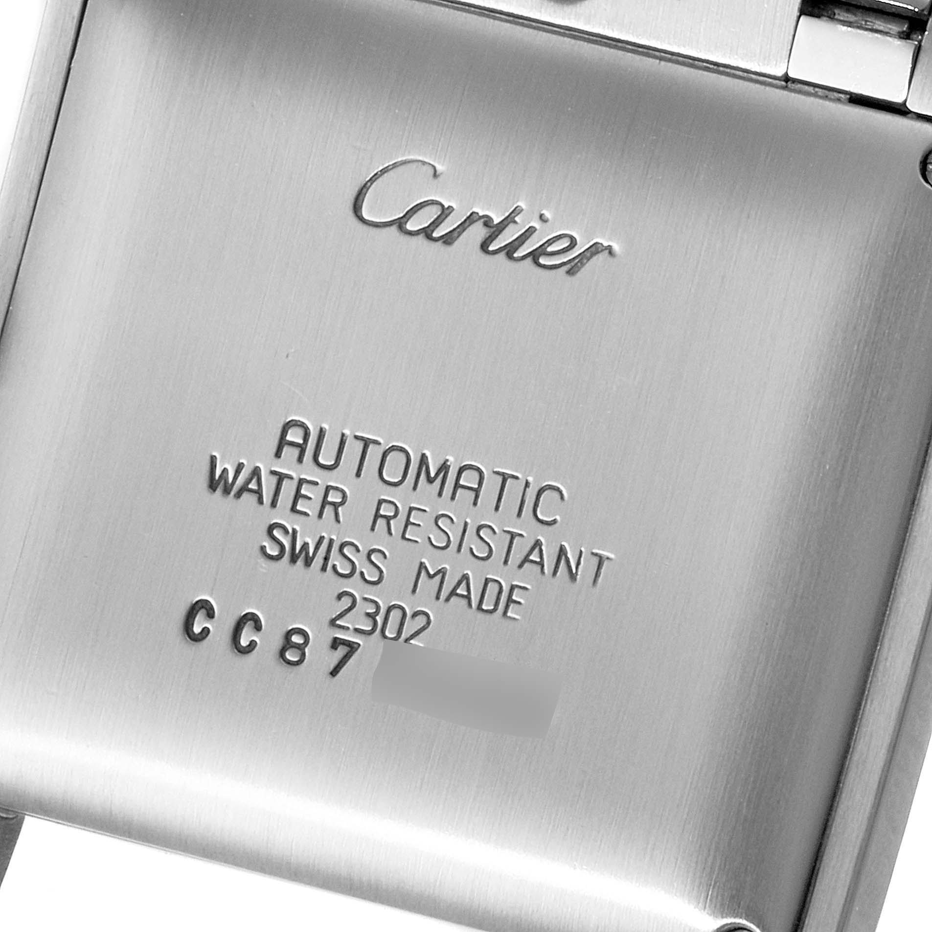 This is a close-up shot of the back case of the Cartier Tank Francaise W51002Q3 Men's Stainless Steel Silver Dial W51002Q3 Men's Stainless Steel Silver Dial watch, showing branding and specifications.