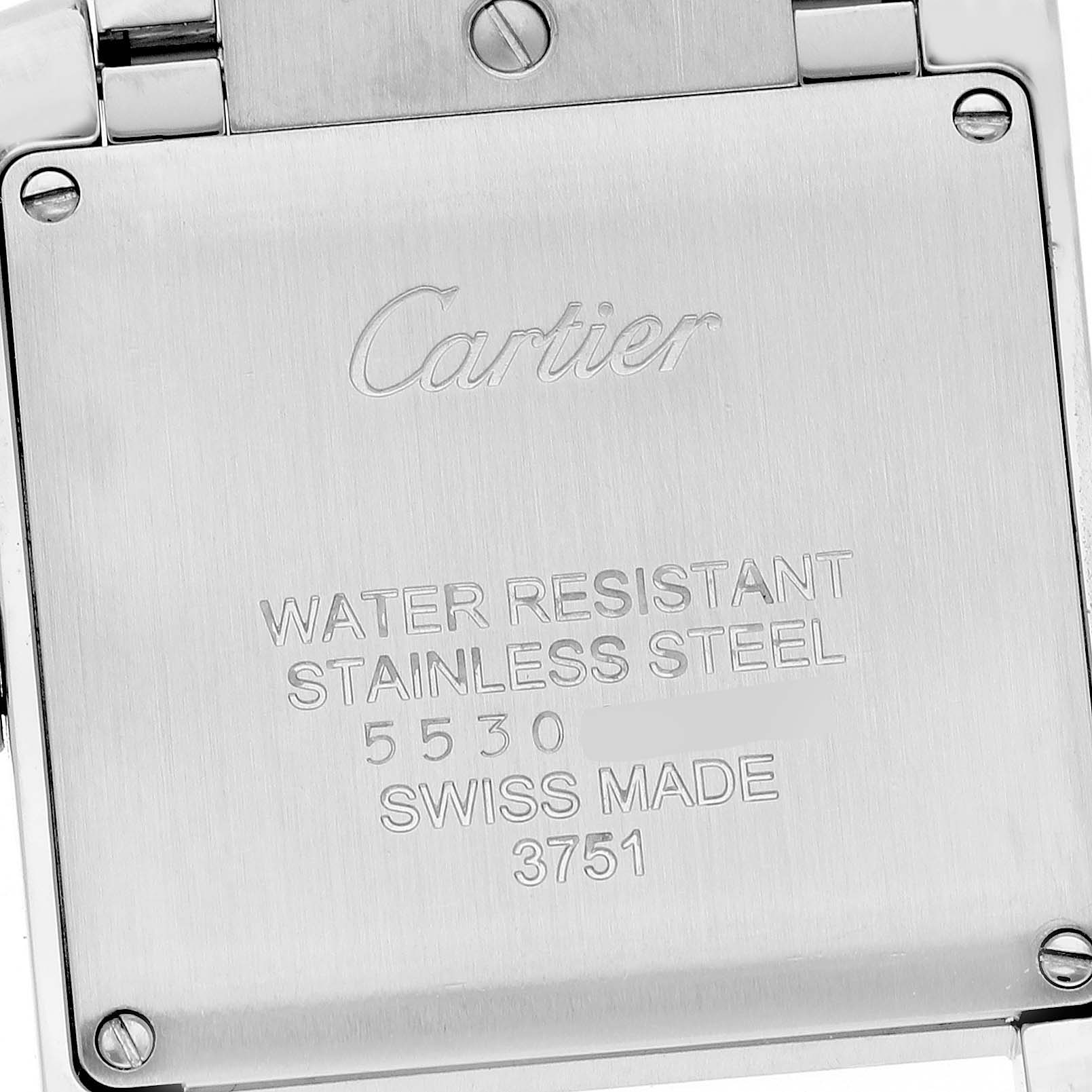The image shows the back of the Cartier Tank Française watch, highlighting the engraved details on its stainless steel case back.