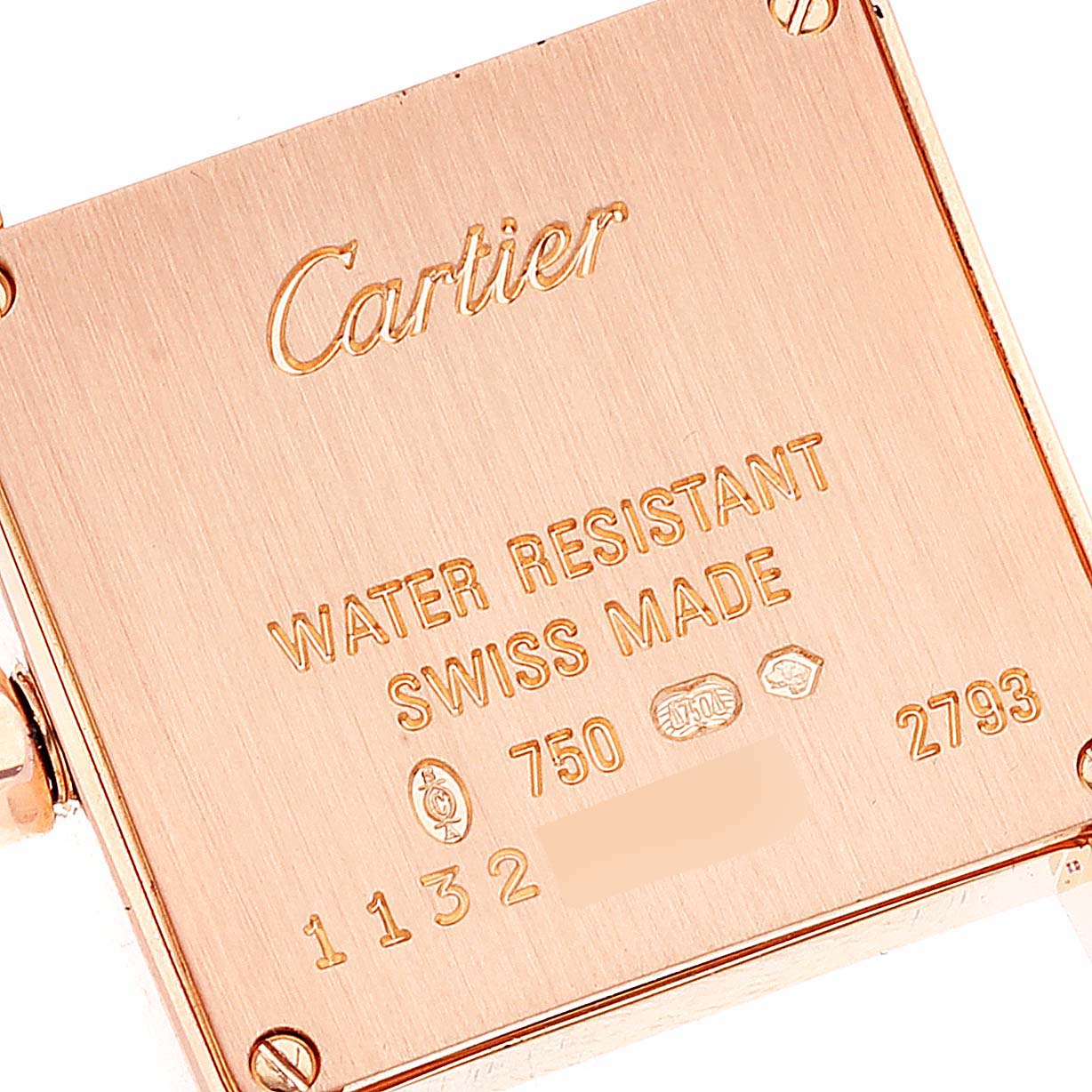 The image shows the case back of a Cartier Tank Francaise WE104531 Women's Rose Gold Silver Dial WE104531 Women's Rose Gold Silver Dial watch, highlighting its engravings and gold markings.