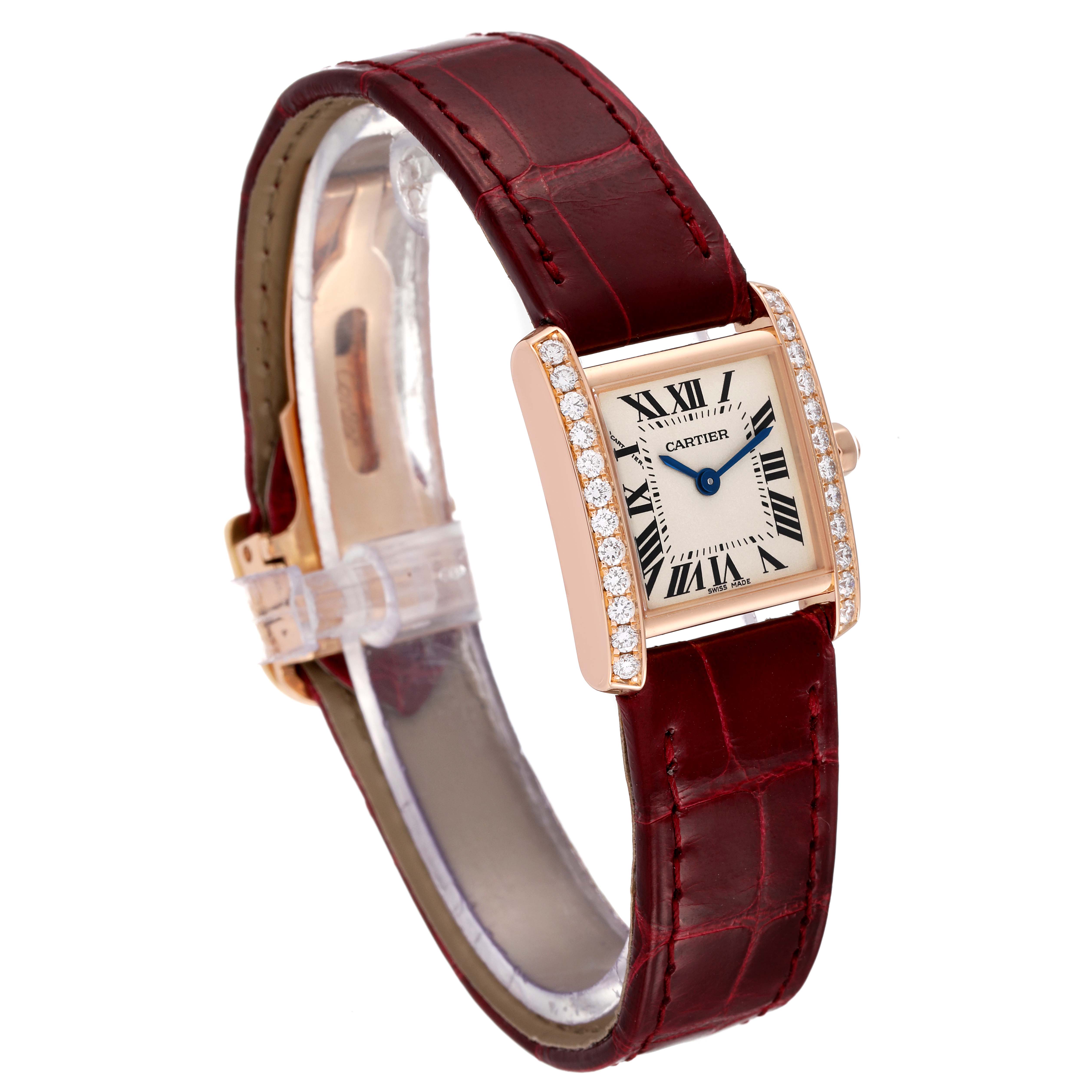 The Cartier Tank Francaise WE104531 Women's Rose Gold Silver Dial WE104531 Women's Rose Gold Silver Dial watch is shown at a slight angle, highlighting its diamond-set bezel and red leather strap.