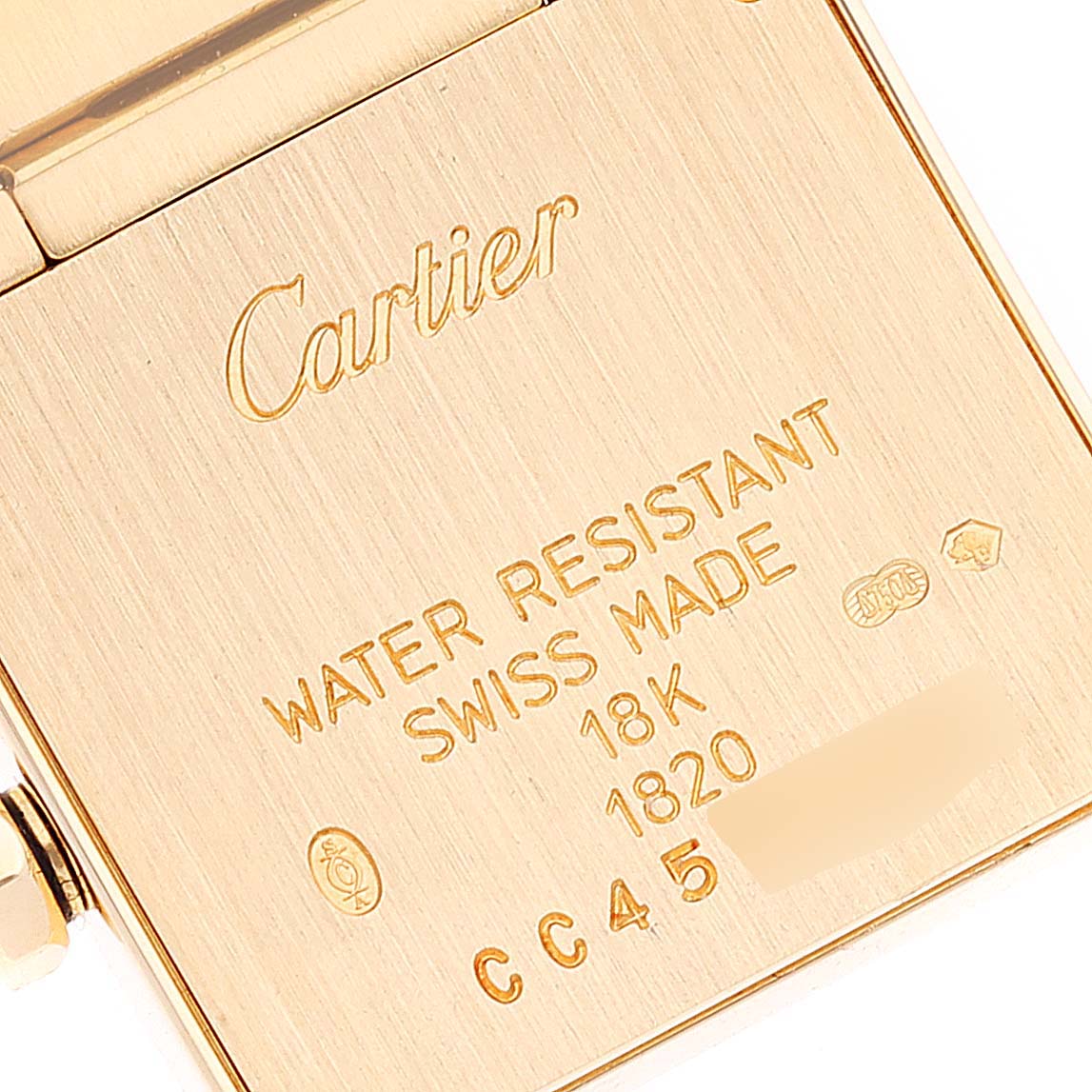 The image shows the back case of a Cartier Tank Francaise W50002N2 Women's Yellow Gold Silver Dial W50002N2 Women's Yellow Gold Silver Dial watch, highlighting its water resistance, Swiss made, and 18K gold details.