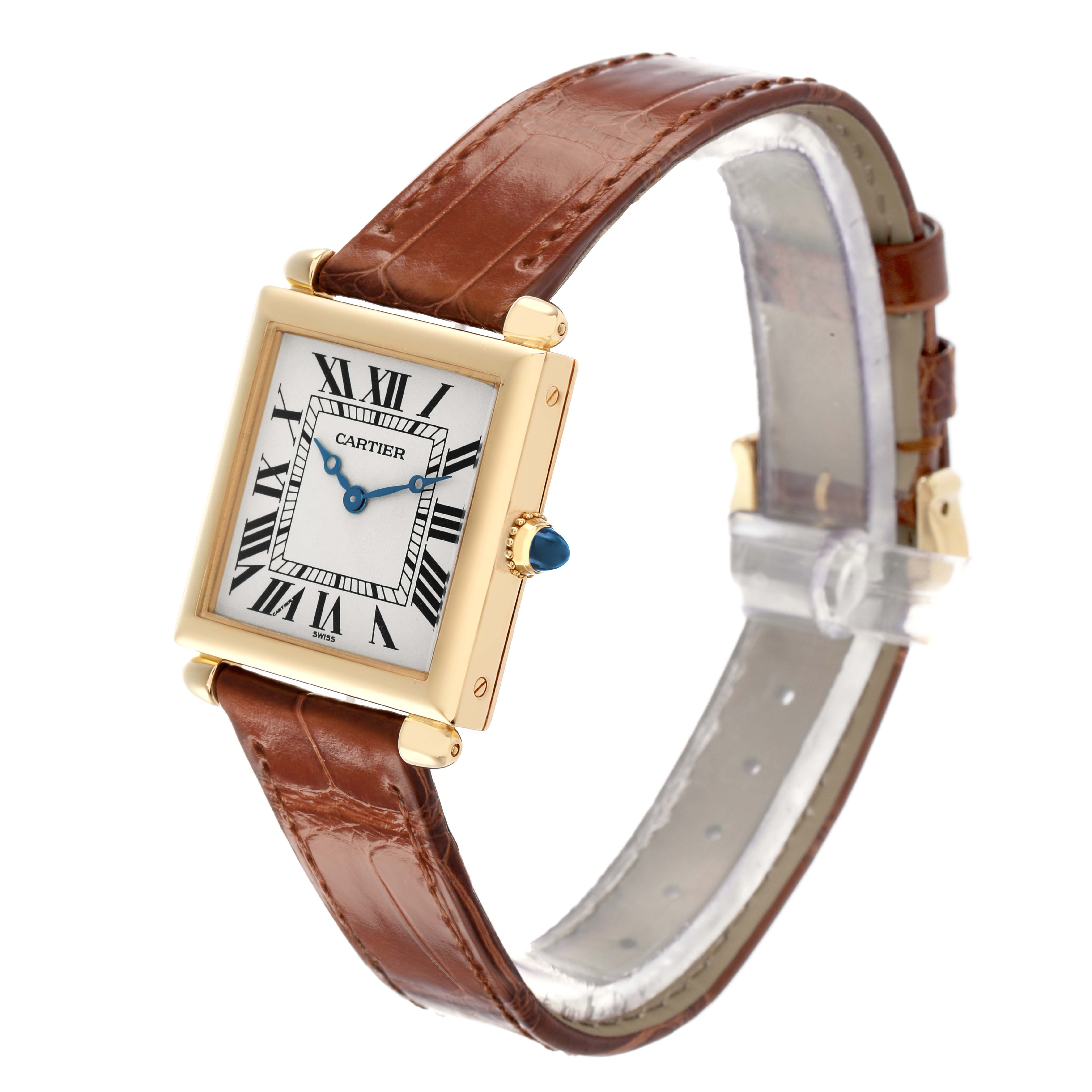 The Cartier Tank Obus W1512256 Women's Yellow Gold Silver Dial watch is shown at a slight angle, displaying the face, bezel, and brown leather strap.
