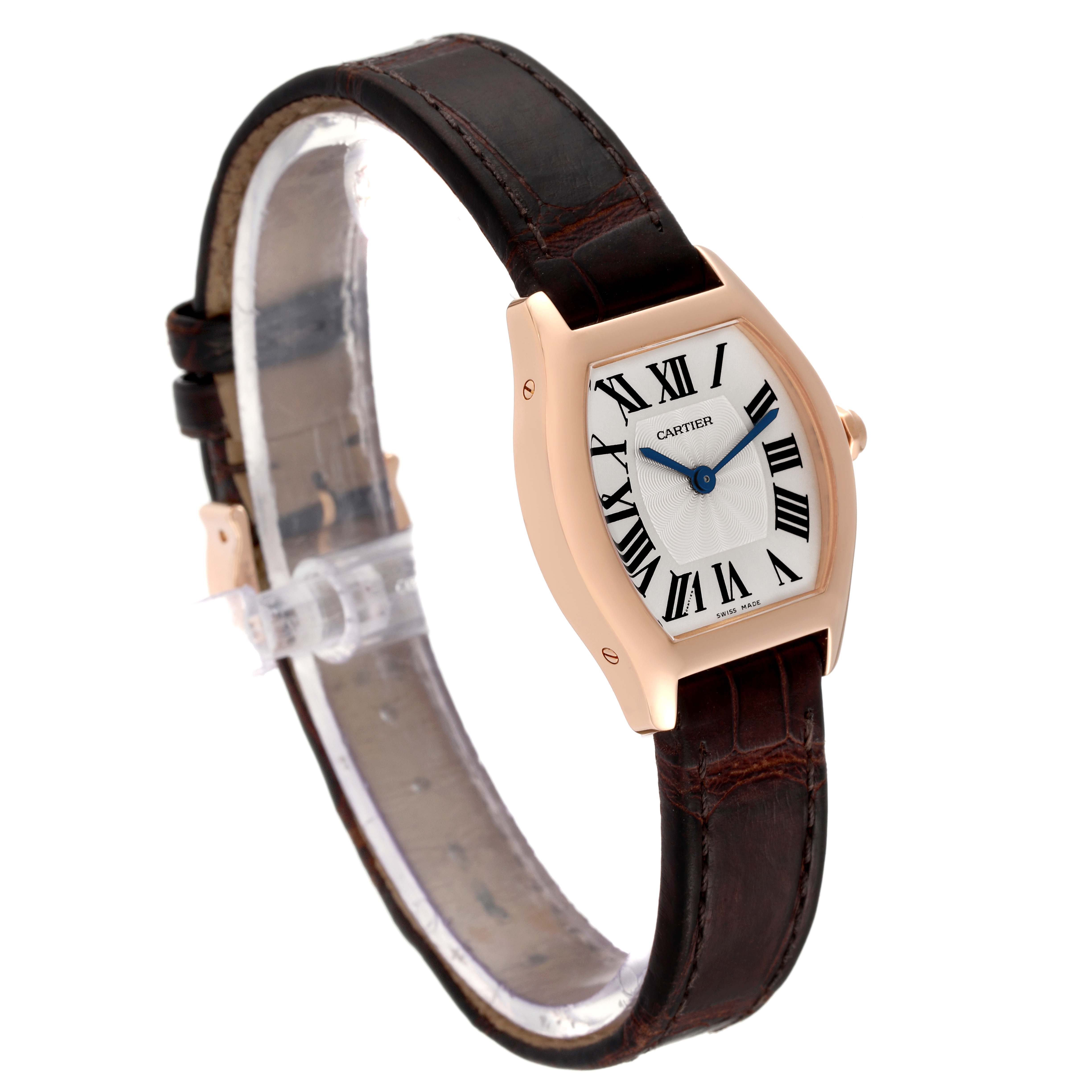 The Cartier Tortue W1556360 Women's Rose Gold Silver Dial W1556360 Women's Rose Gold Silver Dial watch is shown from a side-angle view, displaying its face, case, and brown leather strap.