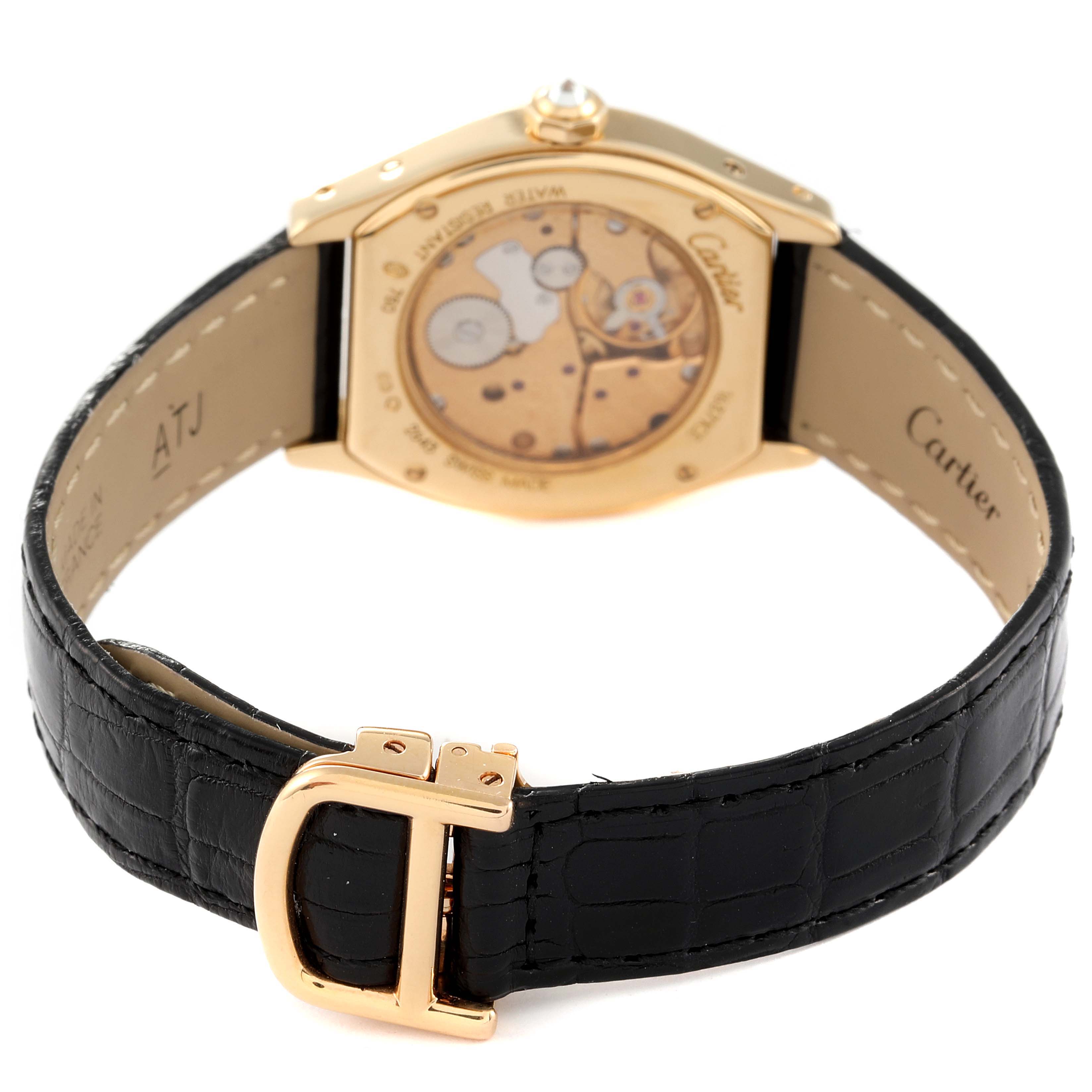 The image shows the back view of a Cartier Tortue 2643 Women's Yellow Gold Silver Dial 2643 Women's Yellow Gold Silver Dial watch, highlighting its open caseback mechanism and black leather strap with a gold buckle.