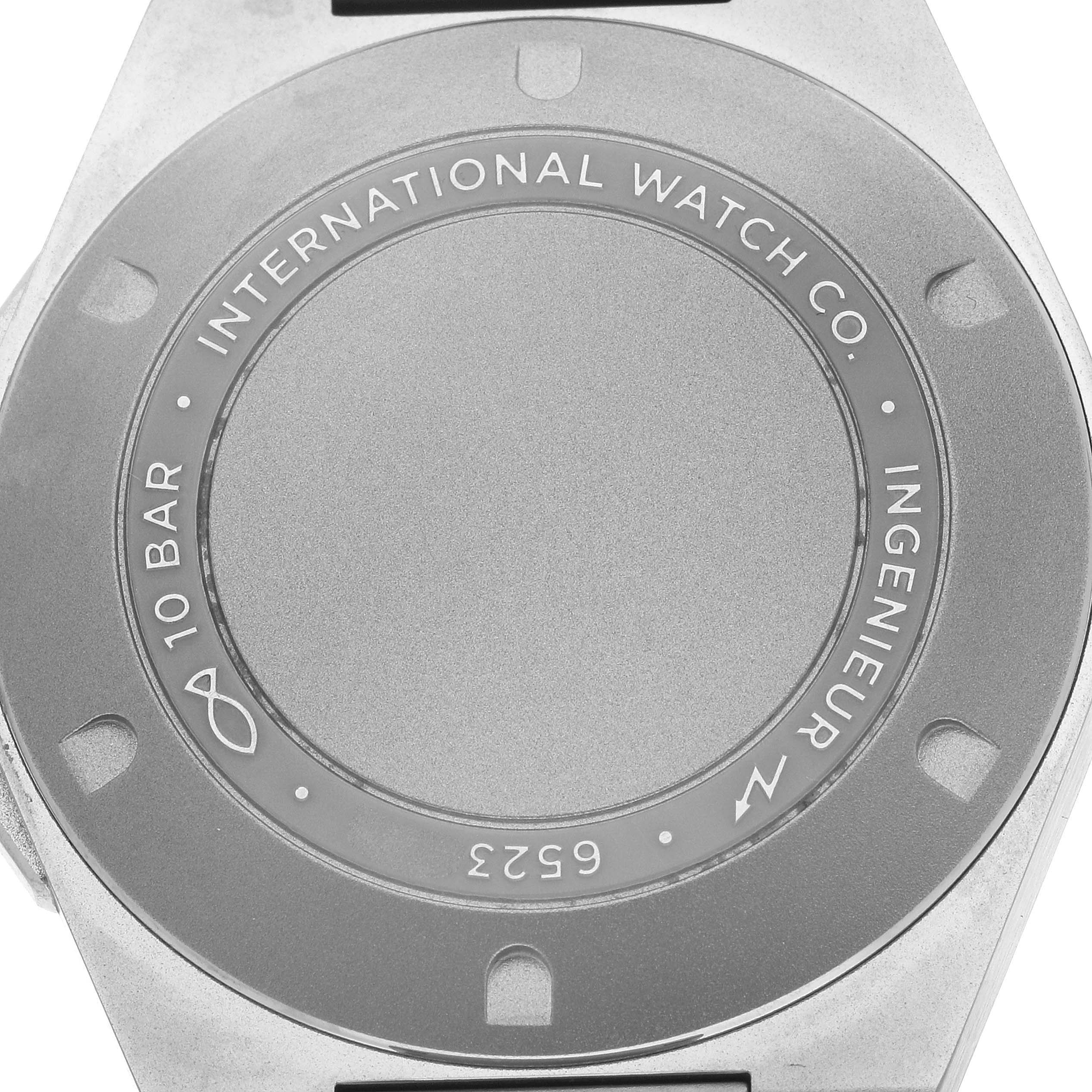 The image shows the back case of an IWC Ingenieur IW328904 Men
s Titanium Grey Dial watch, highlighting the brand engraving and water resistance details.