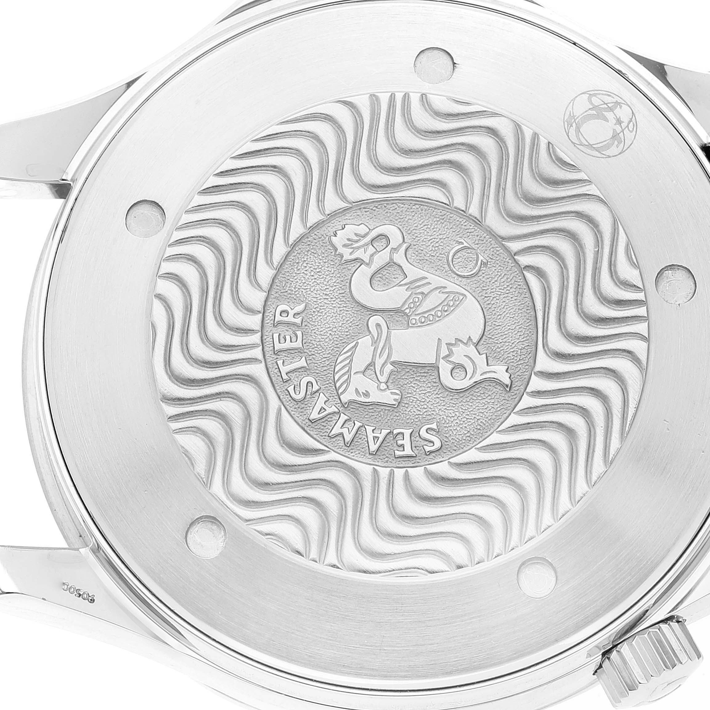 The image shows the case back of an Omega Seamaster 2265.80.00 Men's Stainless Steel Blue Dial 2265.80.00 Men's Stainless Steel Blue Dial watch, featuring its engraved logo and decorative wave pattern.