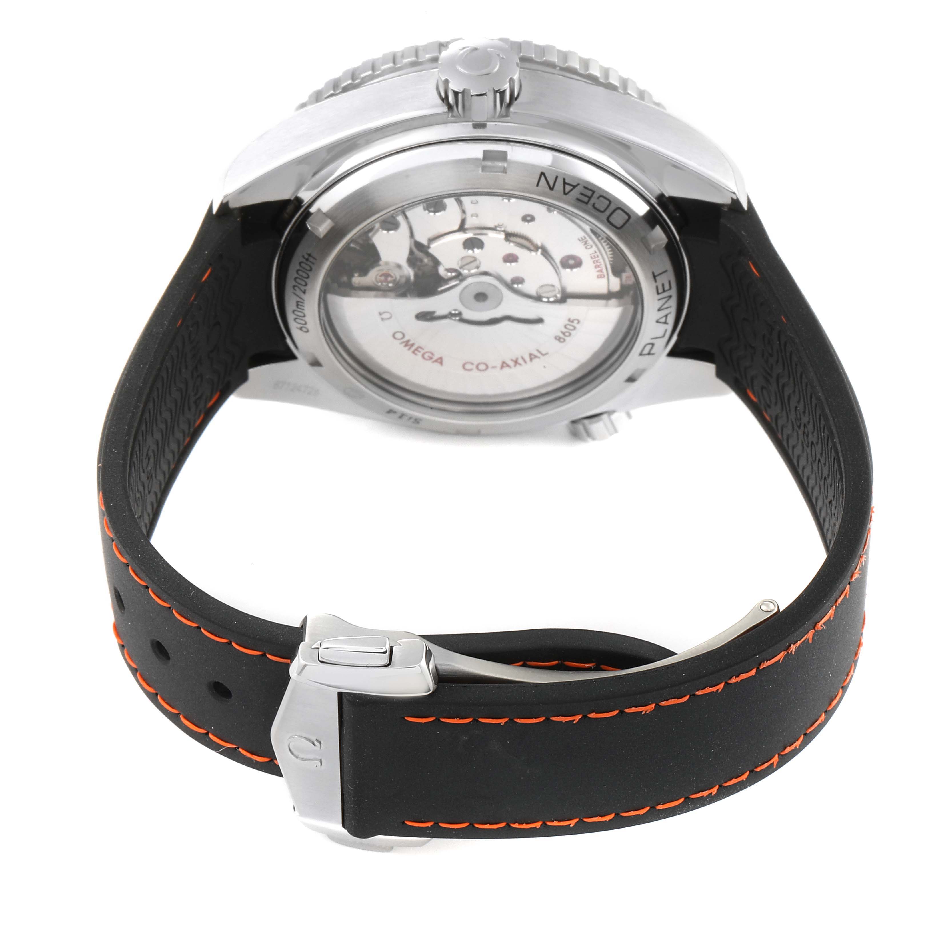 The image shows the back view of an Omega Planet Ocean 232.32.44.22.01.002 Men's Stainless Steel Black Dial 232.32.44.22.01.002 Men's Stainless Steel Black Dial watch, highlighting the case back, crown, and strap with orange stitching.