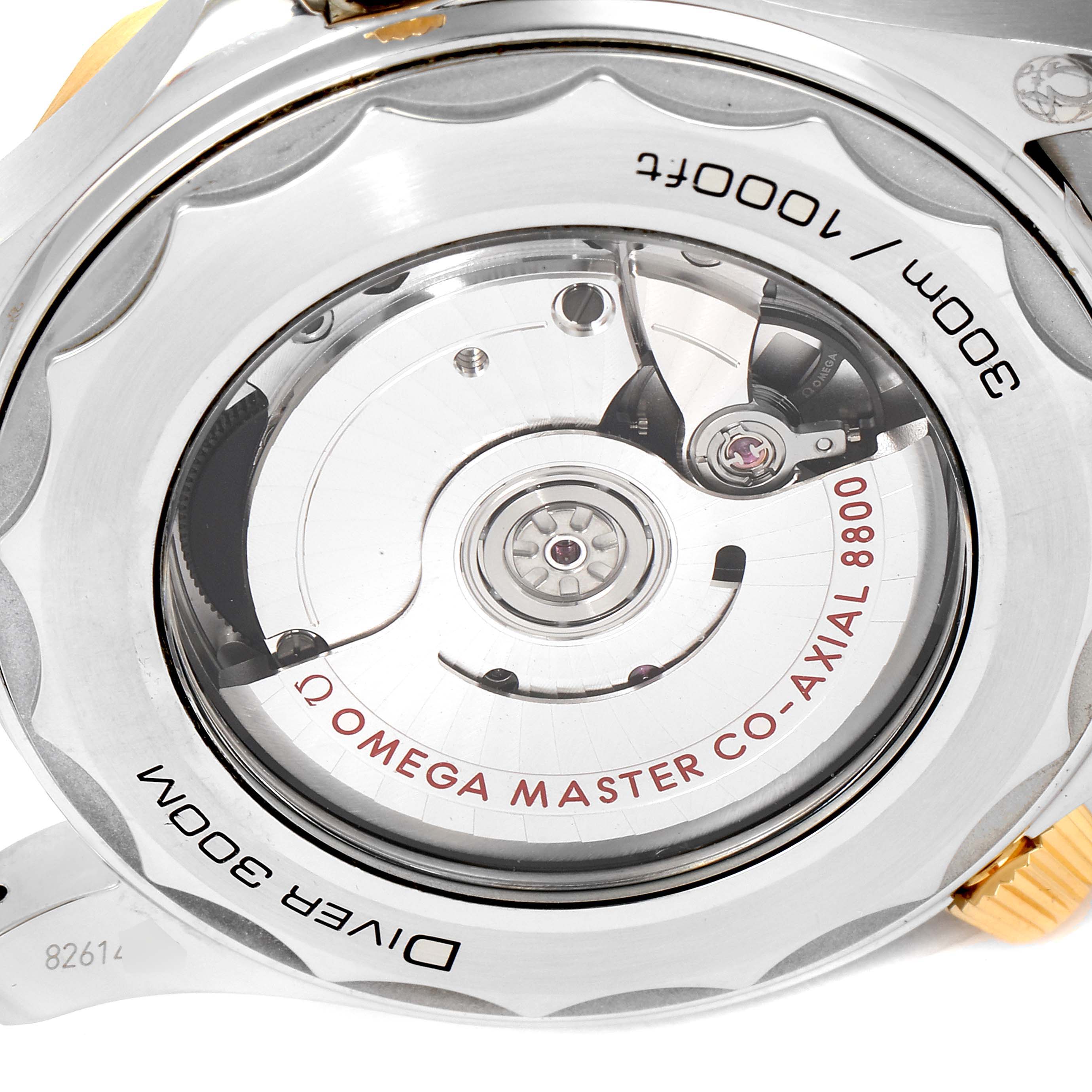 The image shows the back view of the Omega Seamaster 210.20.42.20.01.002 Men's Steel and Gold (two tone) Black Dial 210.20.42.20.01.002 Men's Steel and Gold (two tone) Black Dial watch featuring its Co-Axial 8800 movement and transparent case back.