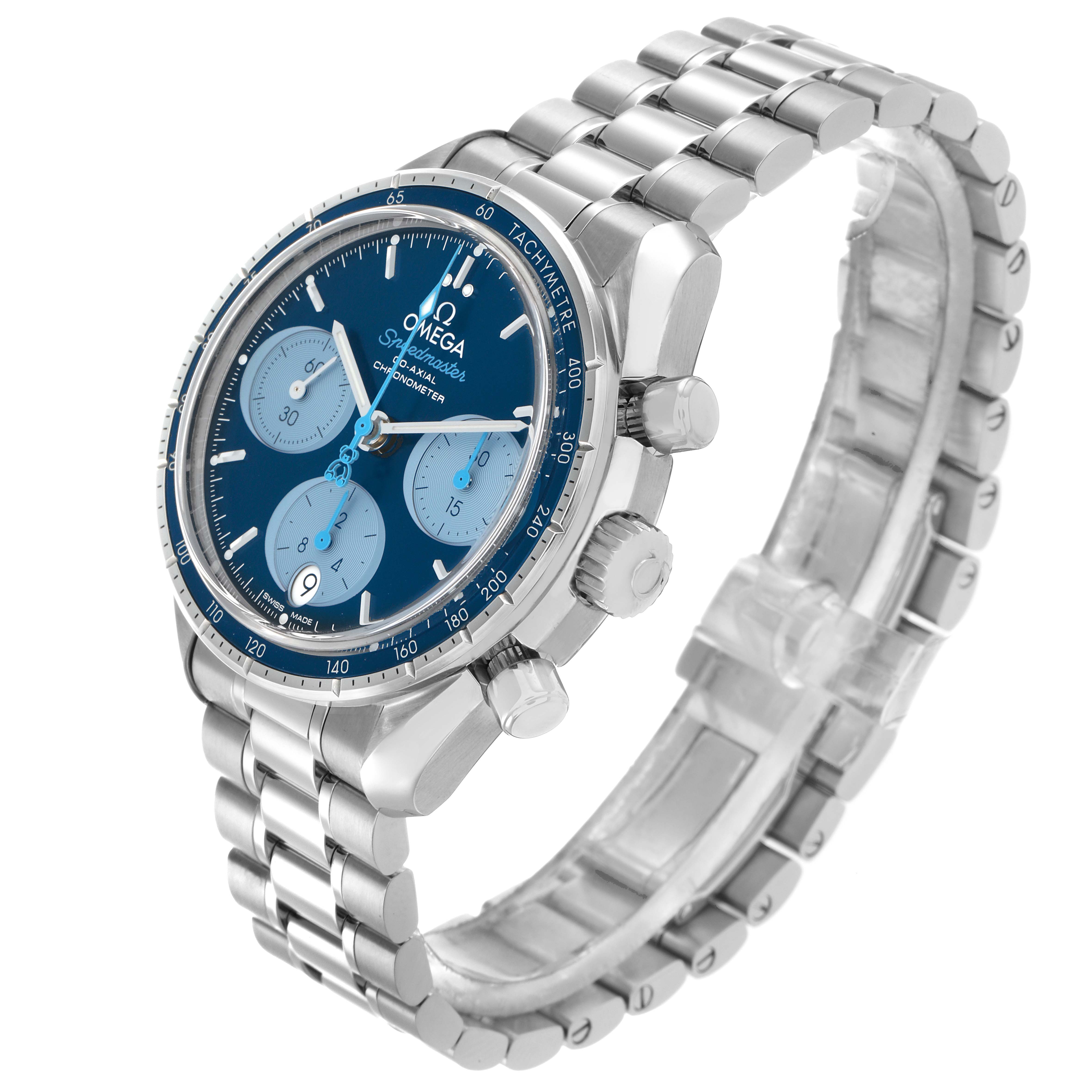 The Omega Speedmaster 324.30.38.50.03.002 Men
s Stainless Steel Blue Dial watch is shown at a three-quarter angle, highlighting the dial, bezel, and bracelet.