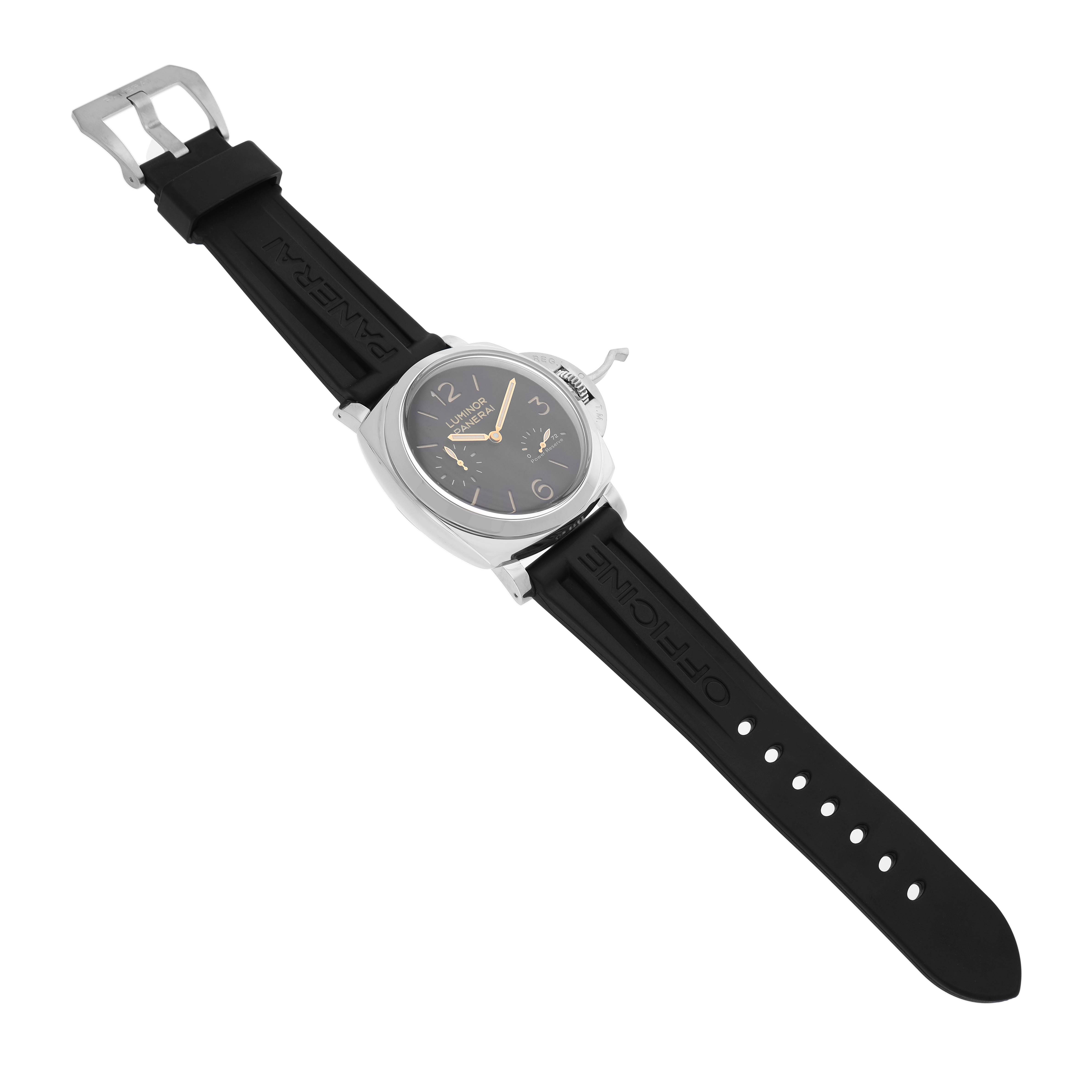 The image shows a Luminor model by Panerai at a slight overhead angle, highlighting the case, dial, and the black rubber strap.