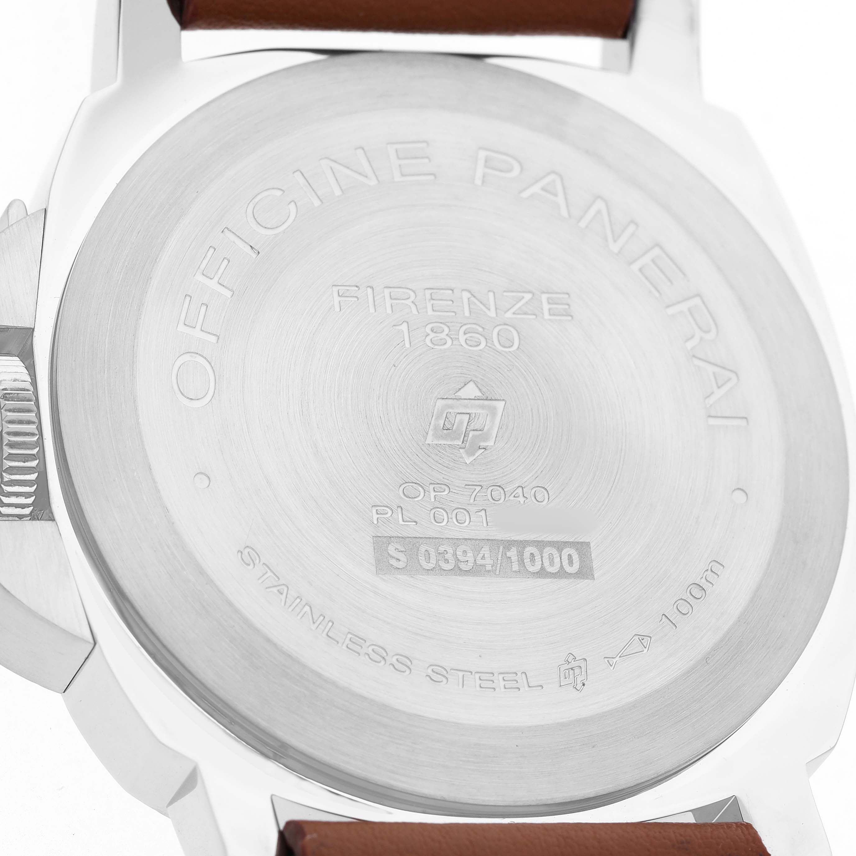 The image shows the back case of a Panerai Luminor PAM00630 Men's Stainless Steel White Dial watch, highlighting engravings and a leather strap.