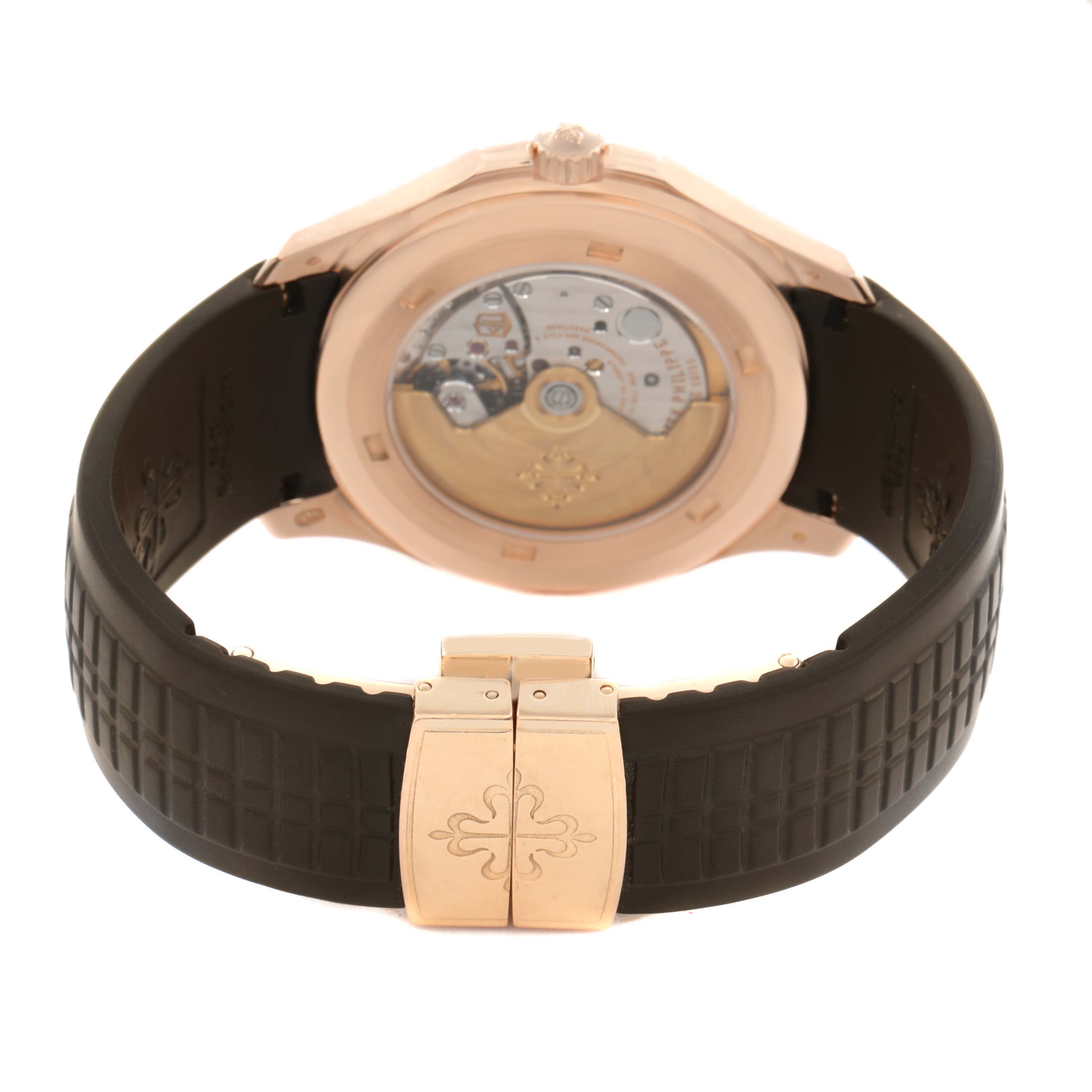 The image shows the back view of a Patek Philippe Aquanaut 5167R Men
s Rose Gold Brown Dial watch, highlighting the clasp and transparent case back.