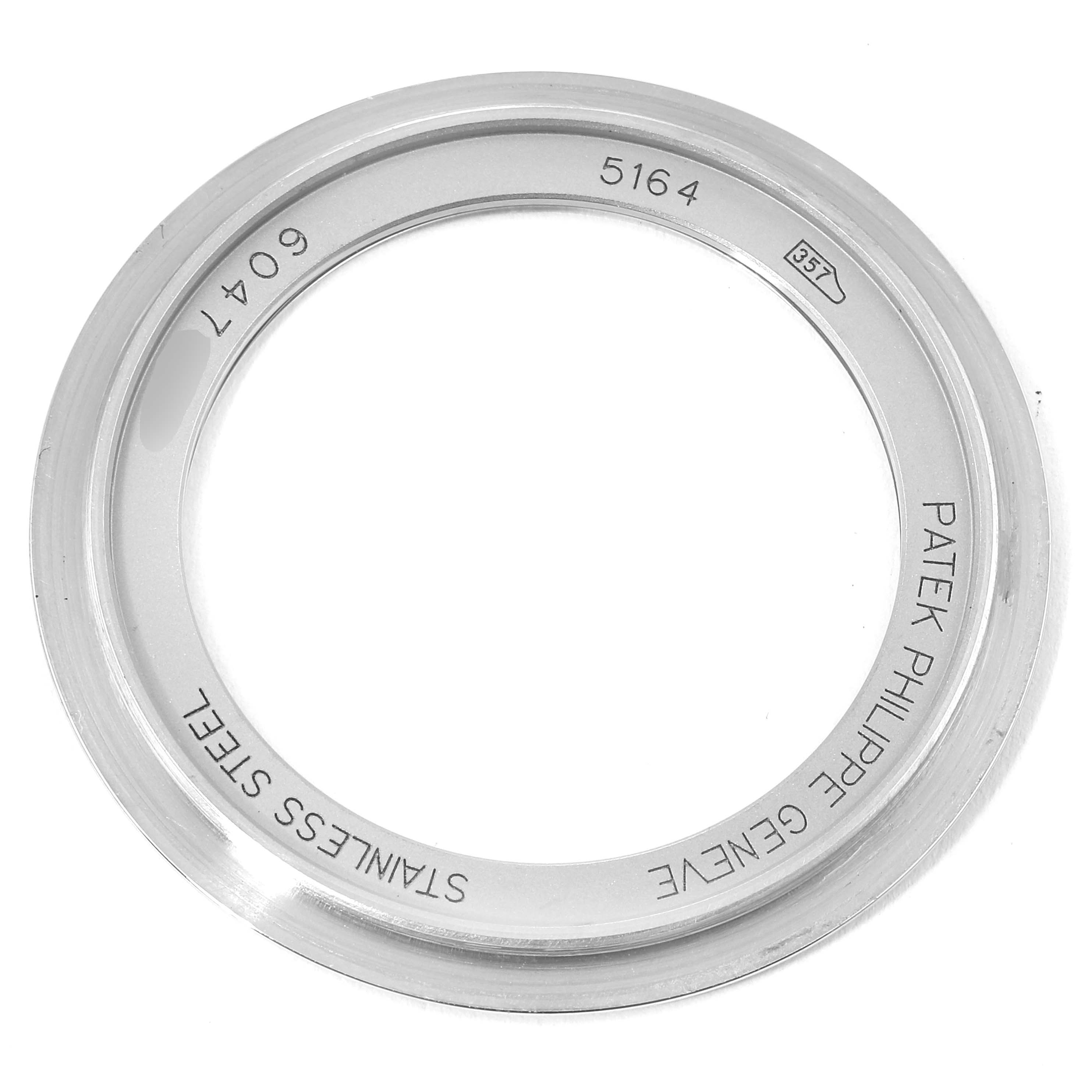 The image shows the back case of a Patek Philippe Aquanaut 5164A Men's Stainless Steel Black Dial 5164A Men's Stainless Steel Black Dial model watch, viewed from the front.