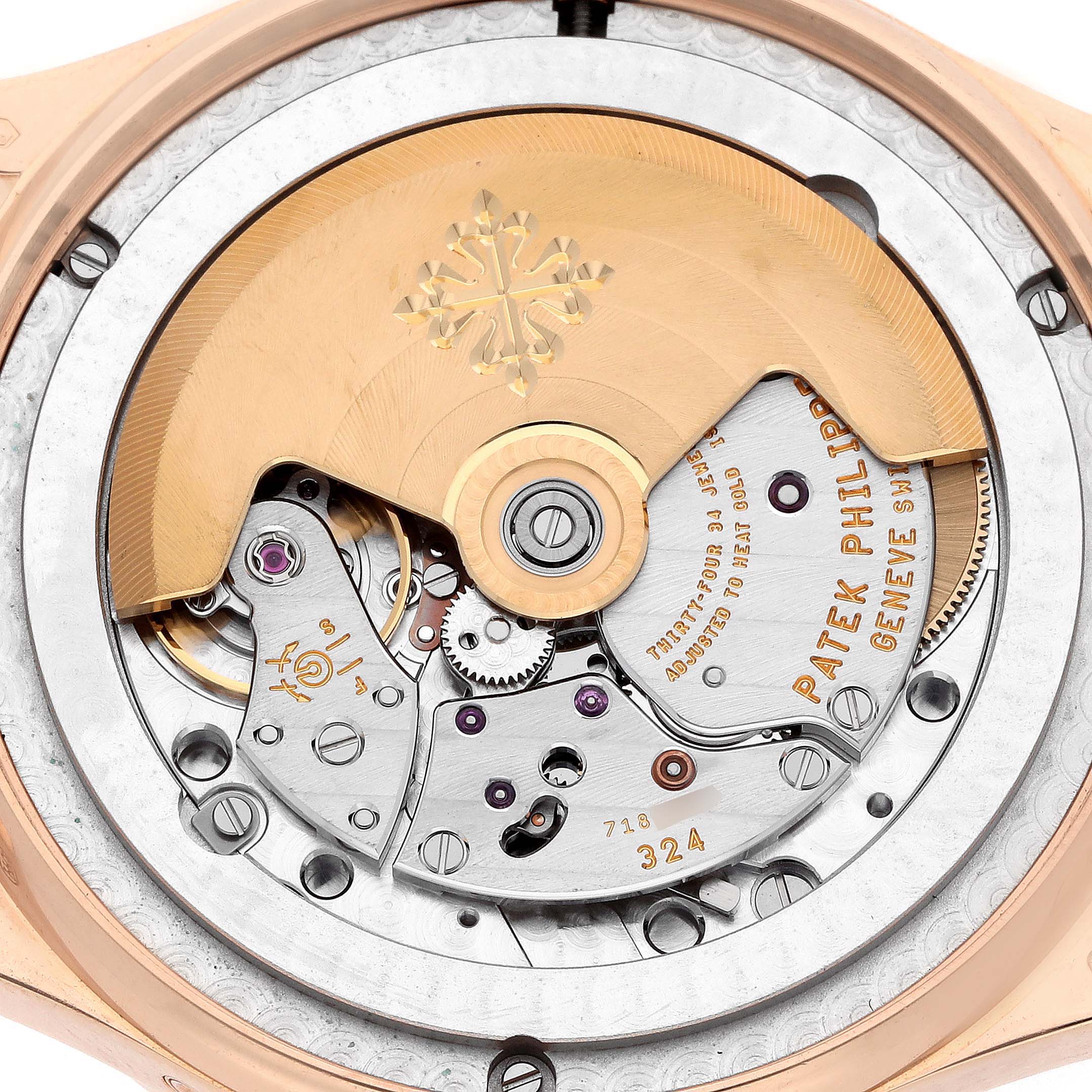 The image shows the movement of a Patek Philippe Complications 5396R Men
s Rose Gold Blue Dial watch, highlighting its rotor and intricate mechanical components.
