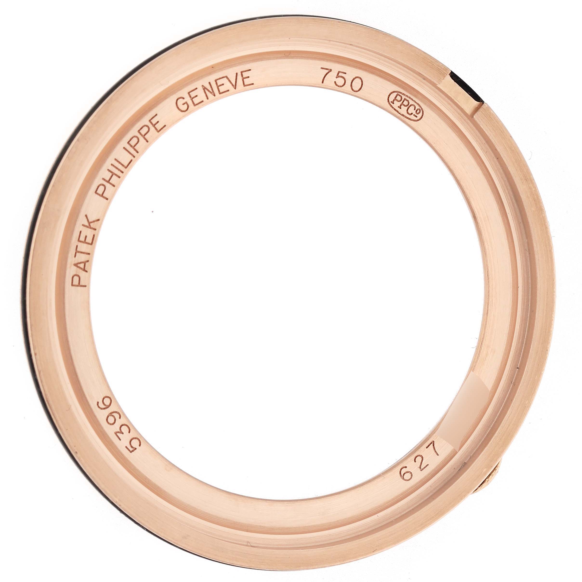 The image shows a Patek Philippe Complications 5396R Men
s Rose Gold Blue Dial model ring bezel from a top-down angle, highlighting inscriptions and markings.