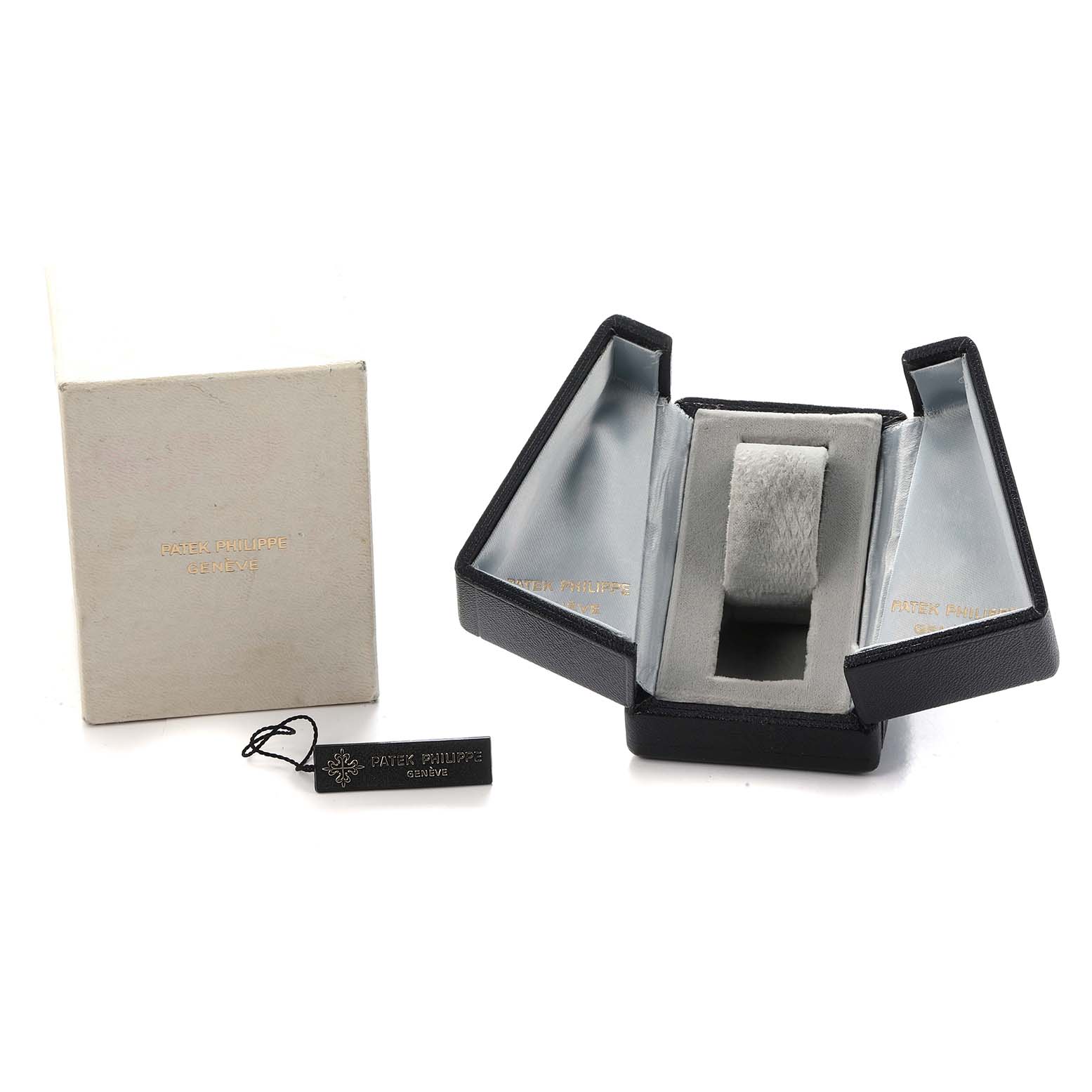 The image shows a Patek Philippe Vintage 4460J Women's Yellow Gold Black Dial watch box, open to display its interior, with an external box and a tag beside it.