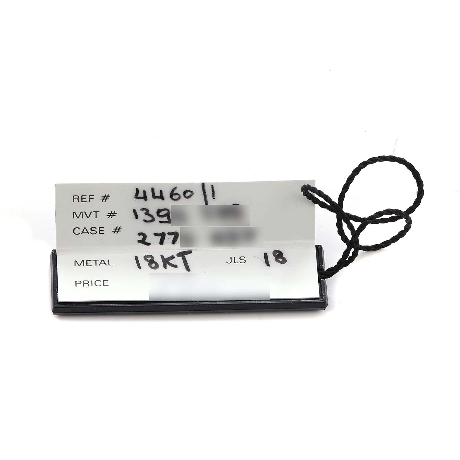 The image shows a tag with details like reference number and material for a Vintage Patek Philippe watch, viewed from above.