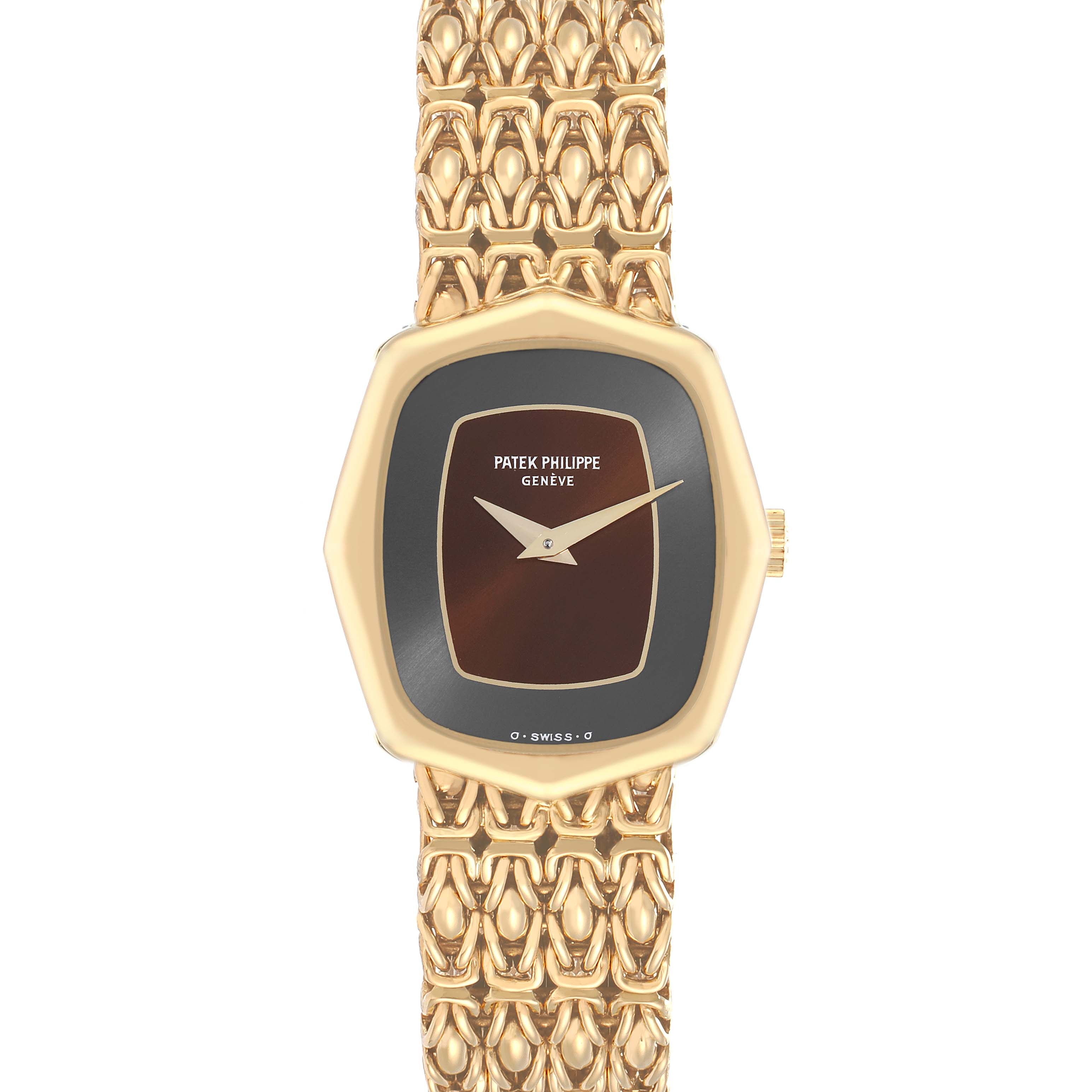 The image shows a top-down view of a Vintage Patek Philippe watch, featuring its gold case, dial, and intricately patterned bracelet.