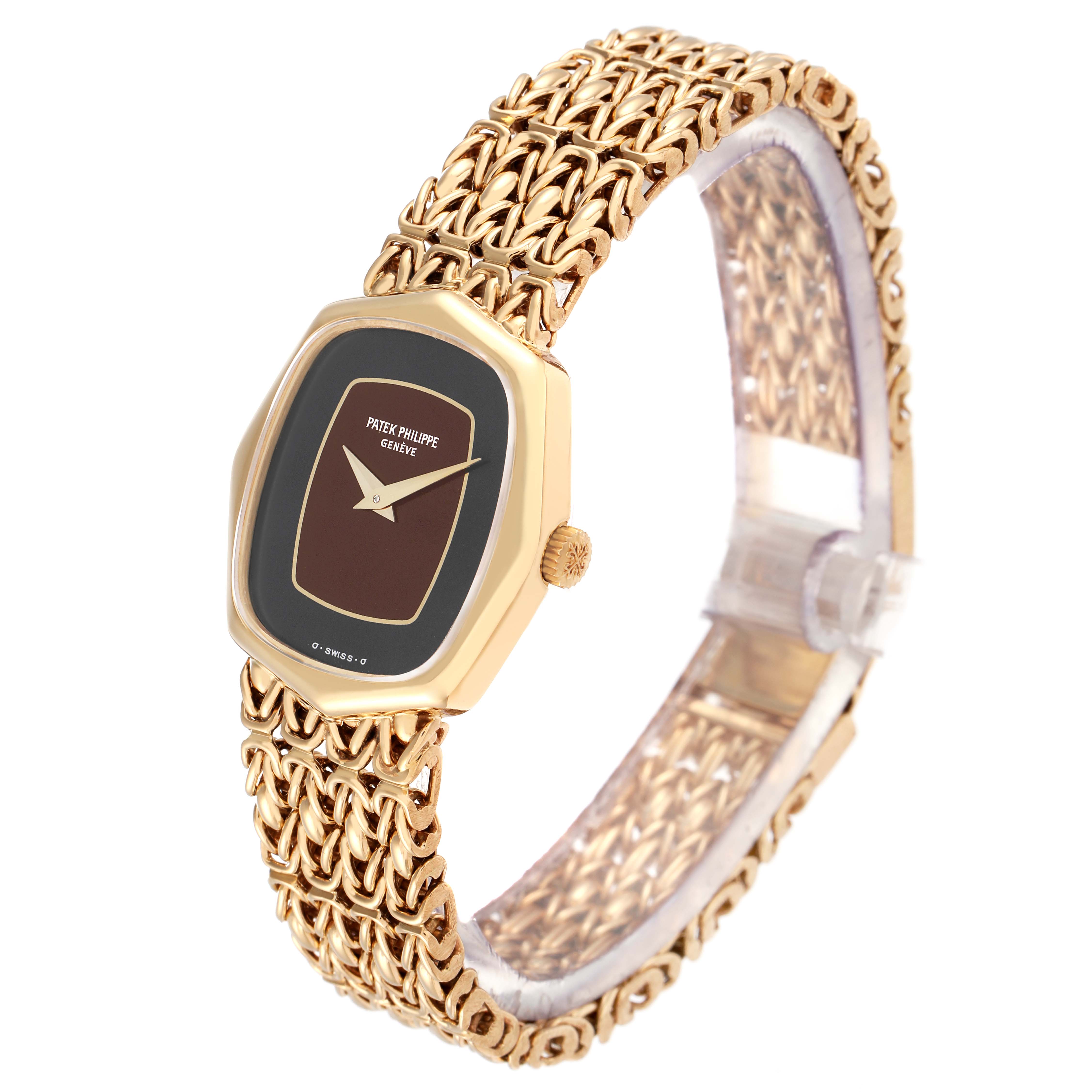 The Vintage Patek Philippe watch is shown at a slight angle, highlighting the face, case, and intricate bracelet.