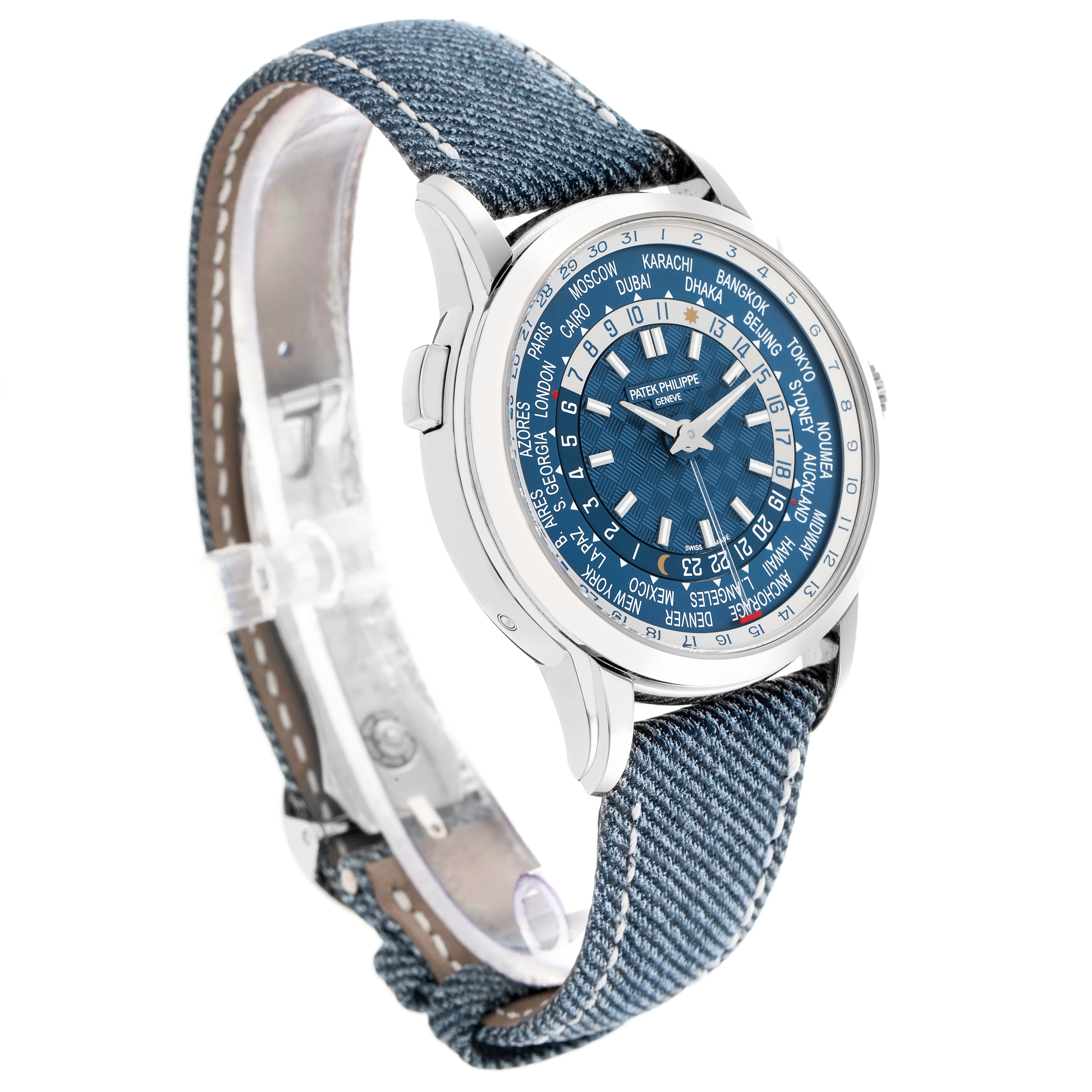The Patek Philippe Complications 5330G Men
s White Gold Blue Dial watch is shown at a three-quarter angle, highlighting the dial, bezel, and denim strap.