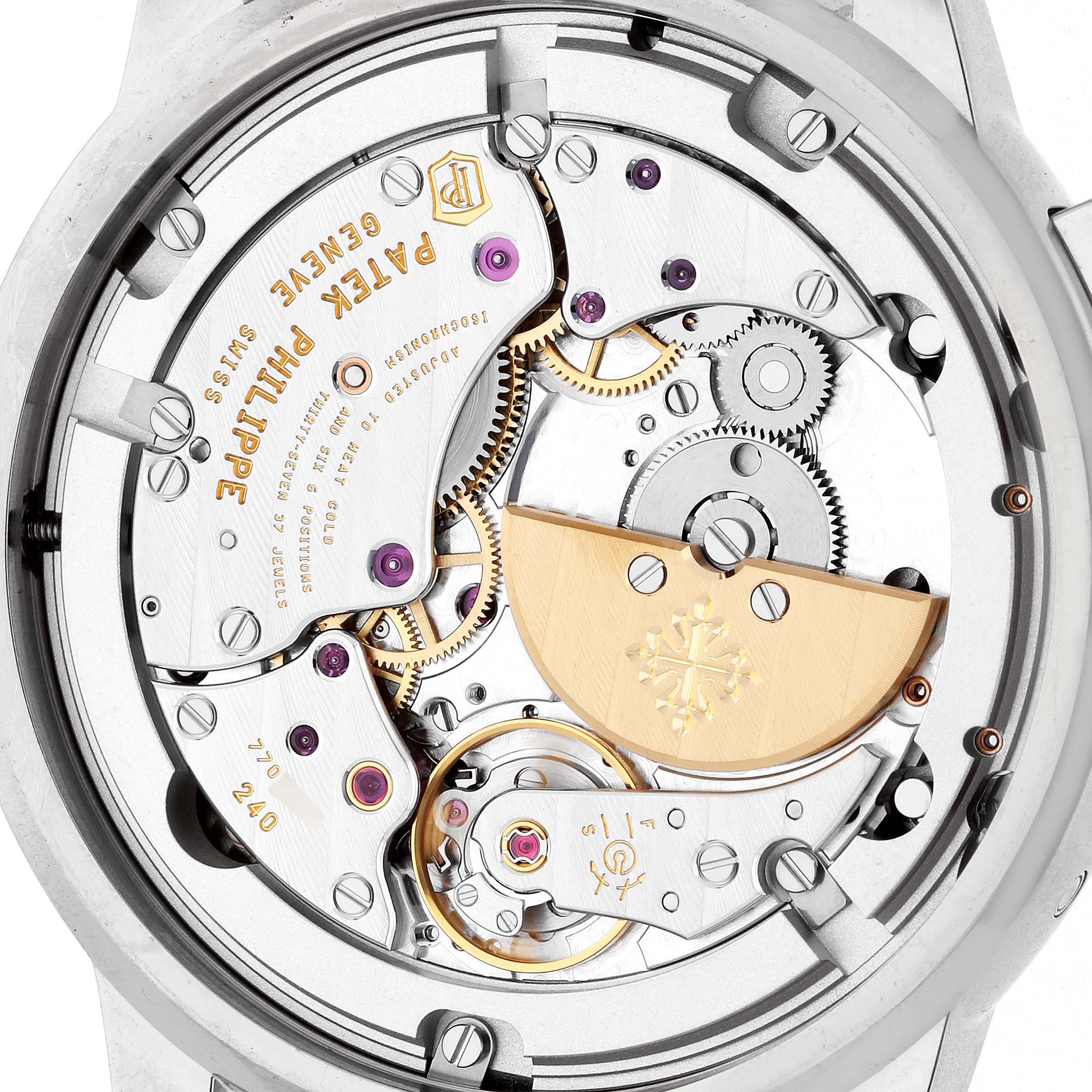 The image shows the back view of a Patek Philippe Complications 5330G Men
s White Gold Blue Dial watch, highlighting its movement and intricate mechanics.