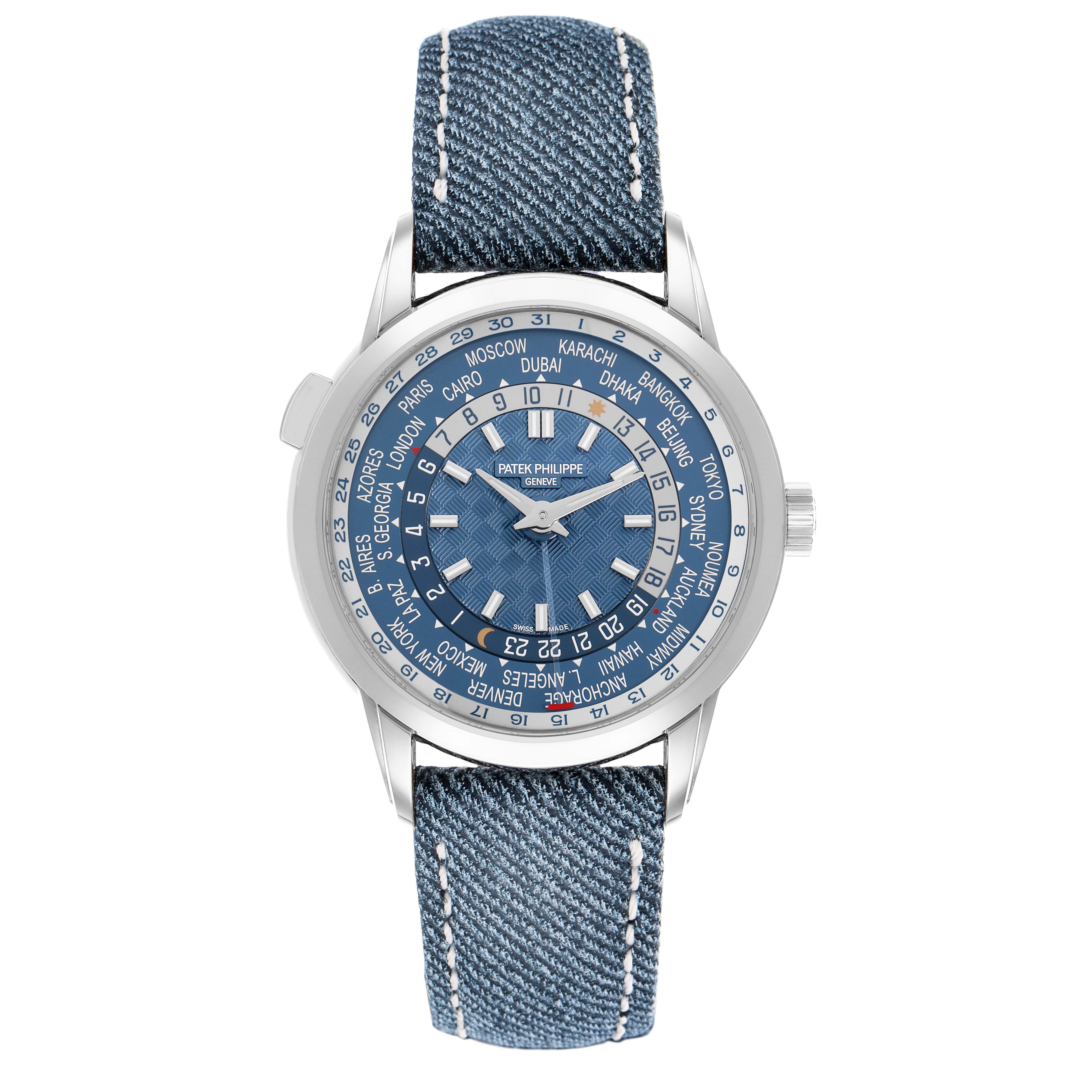 The Patek Philippe Complications 5330G Men's White Gold Blue Dial watch is shown from a top-down angle, highlighting its dial and denim strap.