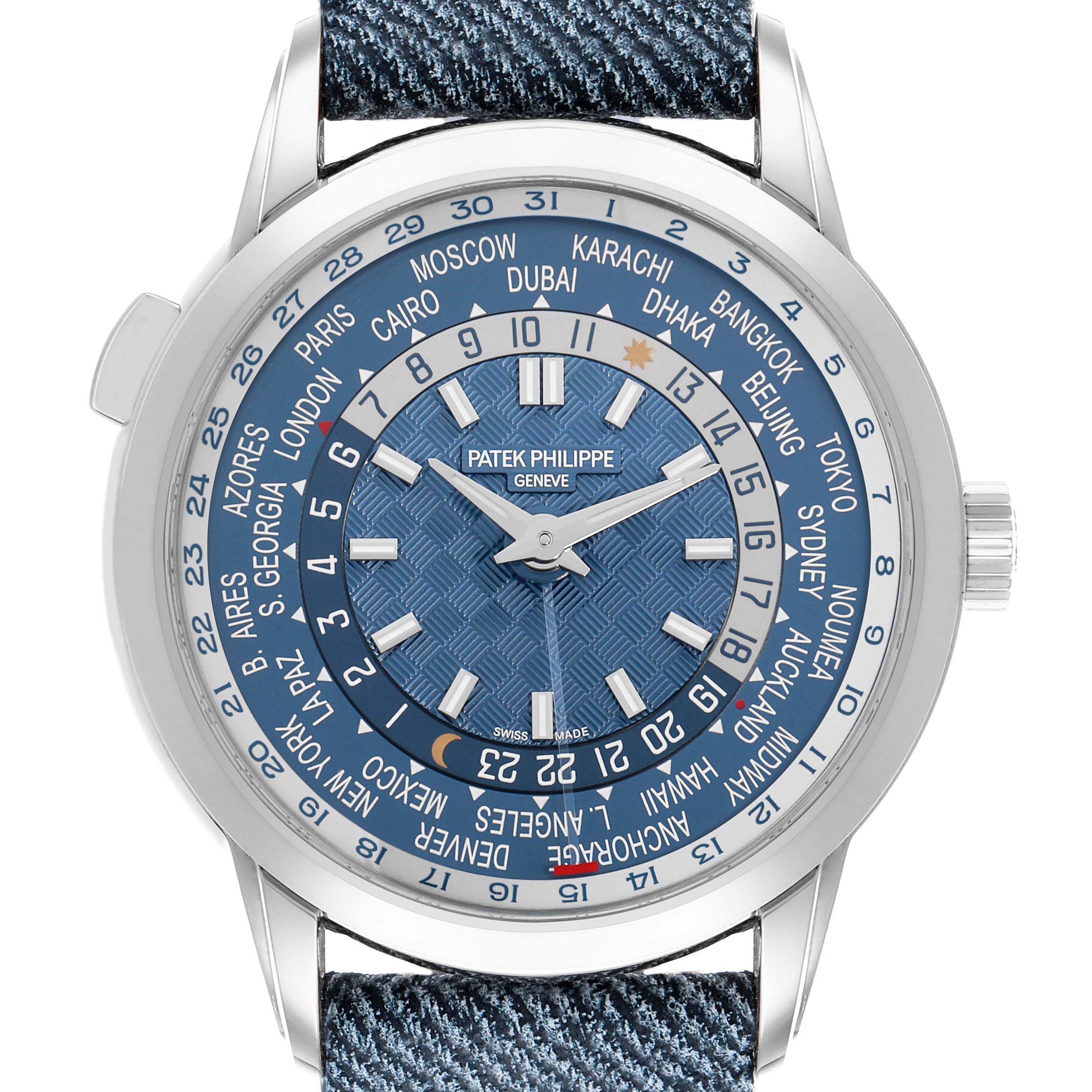 The Patek Philippe Complications 5330G Men's White Gold Blue Dial watch is shown from the front, displaying the dial with world time zones and blue hands.