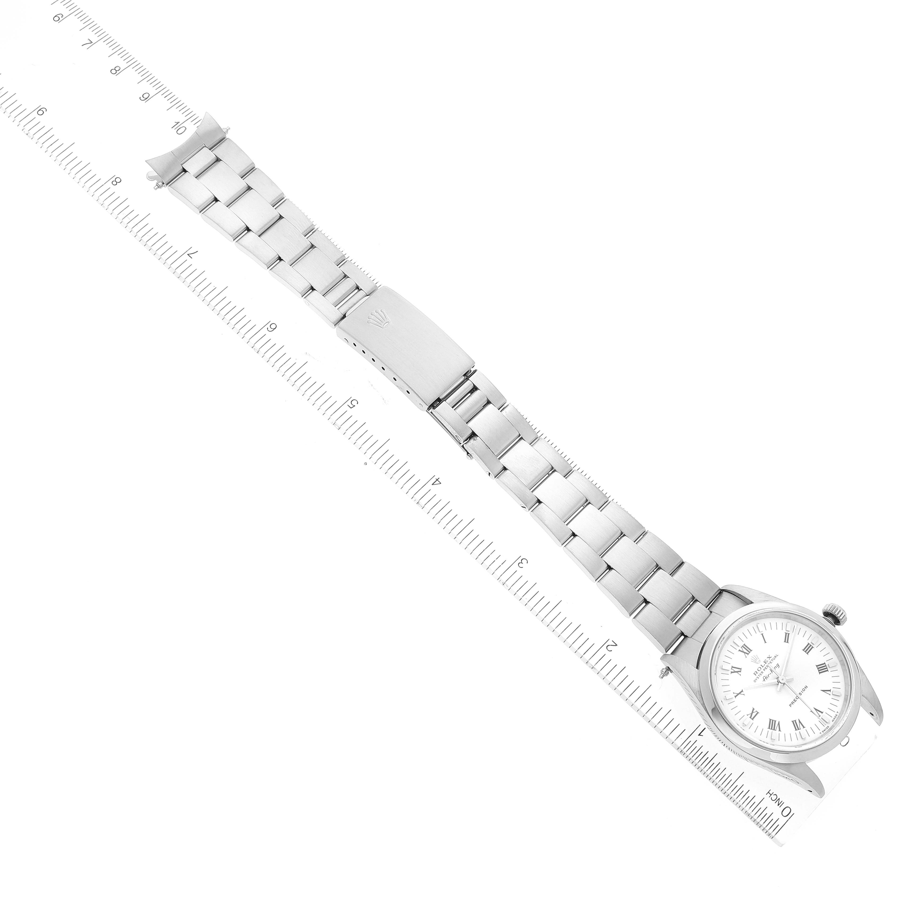 The image shows a top-down view of a Rolex Air-King 14000 Men's Stainless Steel White Dial 14000 Men's Stainless Steel White Dial watch, including the face, bracelet, and clasp, aligned with a measuring ruler.