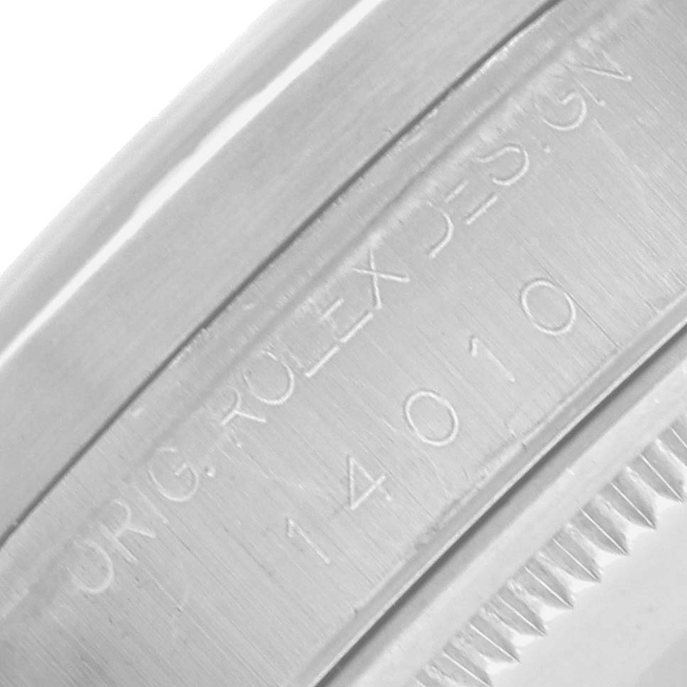 The image shows a close-up of the inner bezel with engravings on a Rolex Air-King 14010 Men
s Stainless Steel Blue Dial watch.