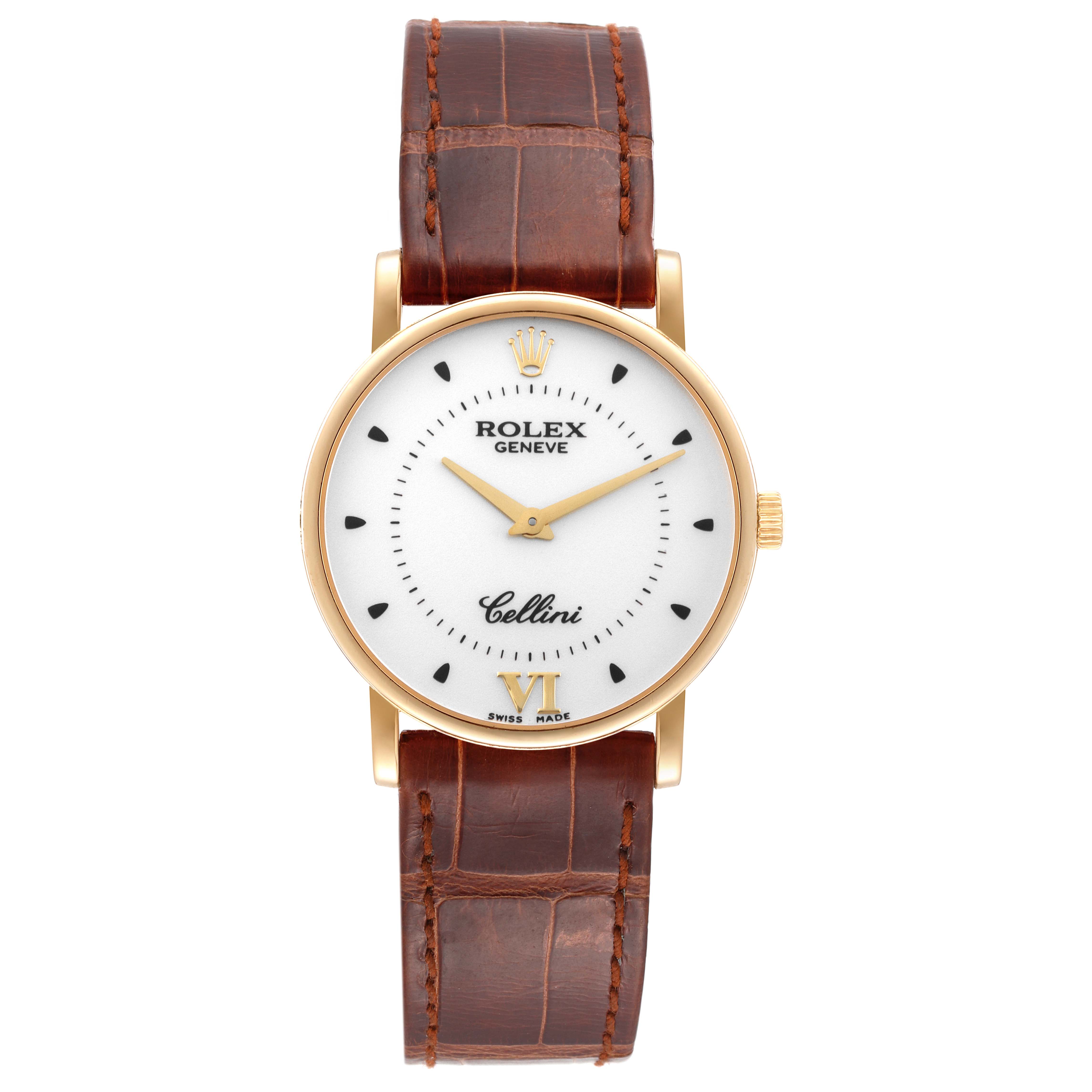 The Rolex Cellini 5115/8 Men's Yellow Gold Silver Dial 5115/8 Men's Yellow Gold Silver Dial watch is shown from a top-down angle, displaying the dial, case, and leather strap.