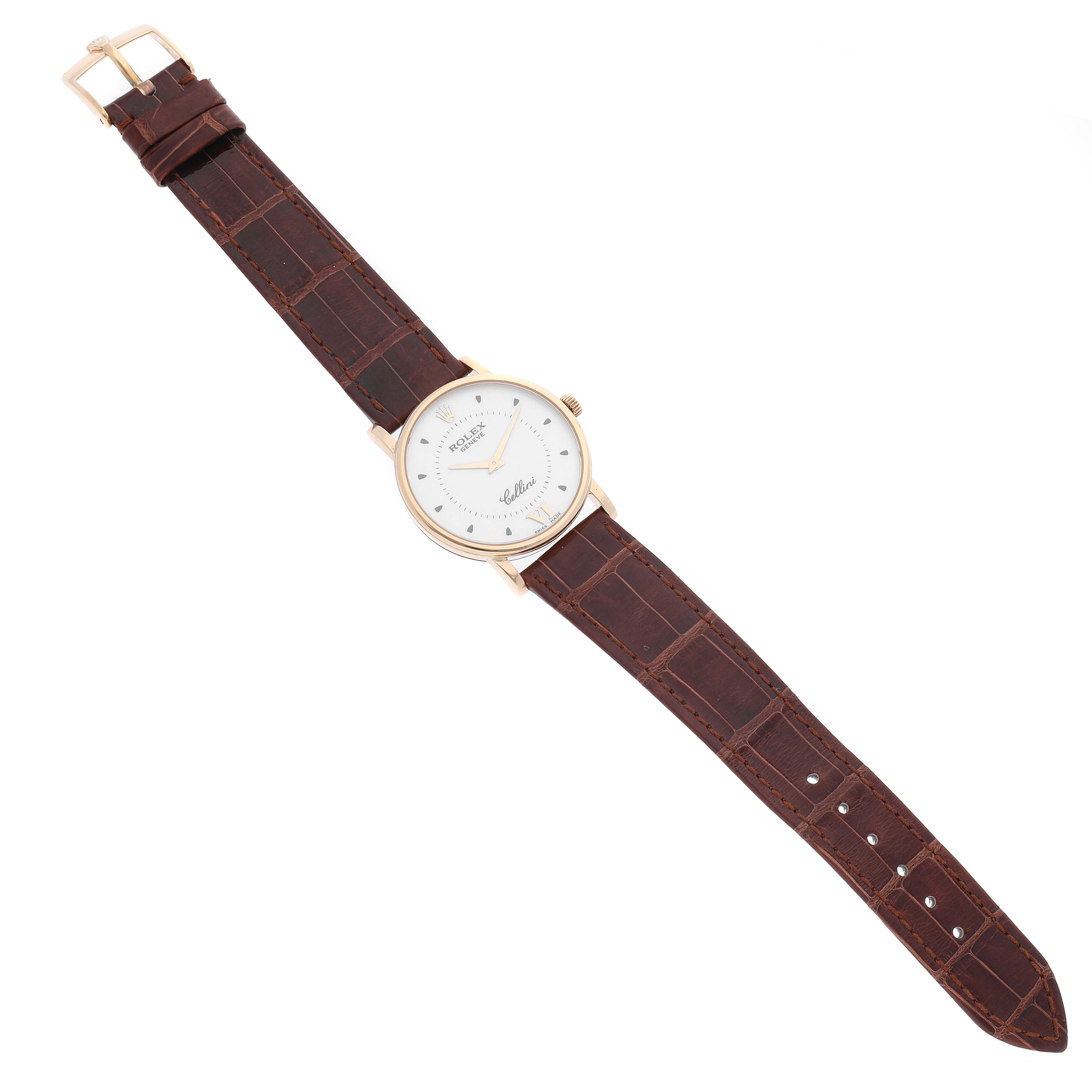 The image shows a top-down view of a Rolex Cellini 5115/8 Men's Yellow Gold Silver Dial 5115/8 Men's Yellow Gold Silver Dial watch, featuring its dial, case, crown, and brown leather strap with a buckle.