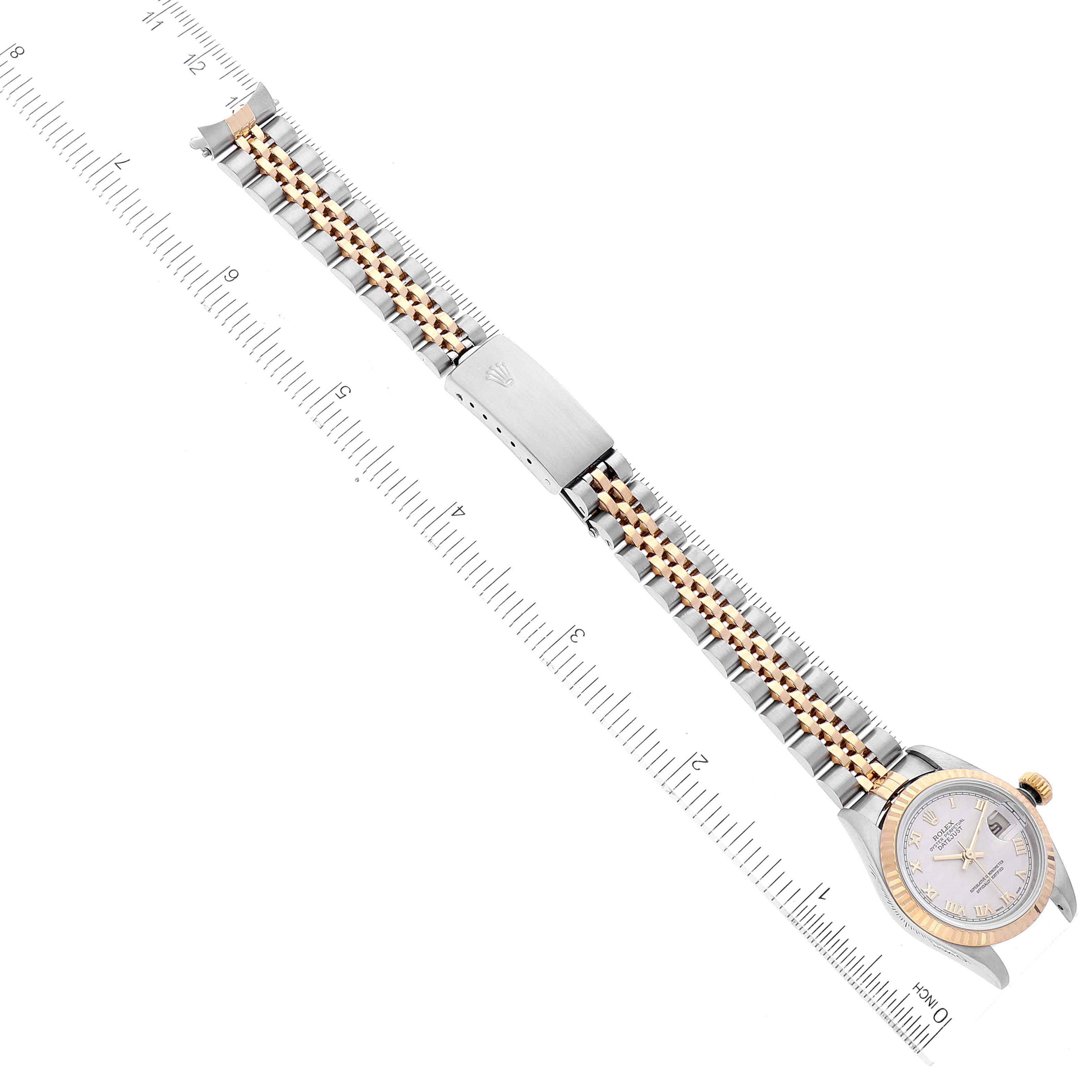 The Rolex Datejust 79173 Women's Steel and Gold (two tone) Beige Dial 79173 Women's Steel and Gold (two tone) Beige Dial watch is shown from an overhead view, highlighting the band, bezel, dial, and clasp.