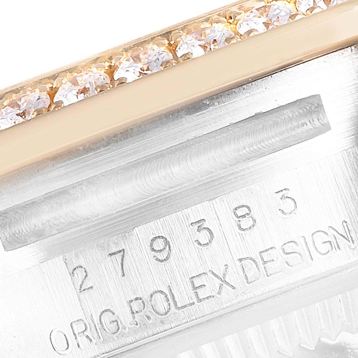 The image shows a close-up of the Rolex Datejust 279383 Women's Steel and Gold (two tone) Green Dial 279383 Women's Steel and Gold (two tone) Green Dial model's serial number and diamond-studded bezel.