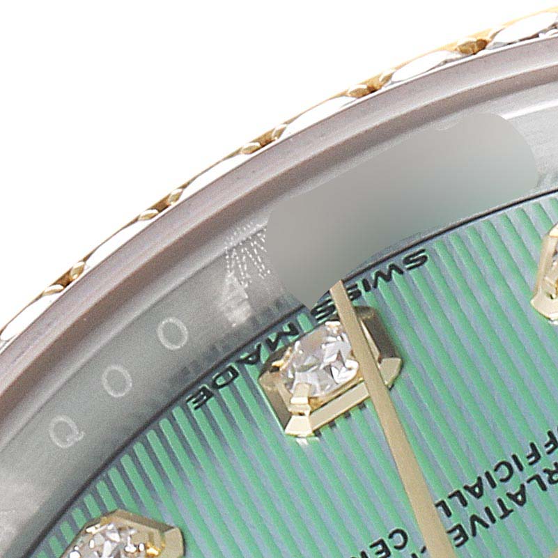 The image shows a close-up of the dial and diamond hour markers of the Rolex Datejust 279383 Women's Steel and Gold (two tone) Green Dial 279383 Women's Steel and Gold (two tone) Green Dial watch, focusing on the "SWISS MADE" text.