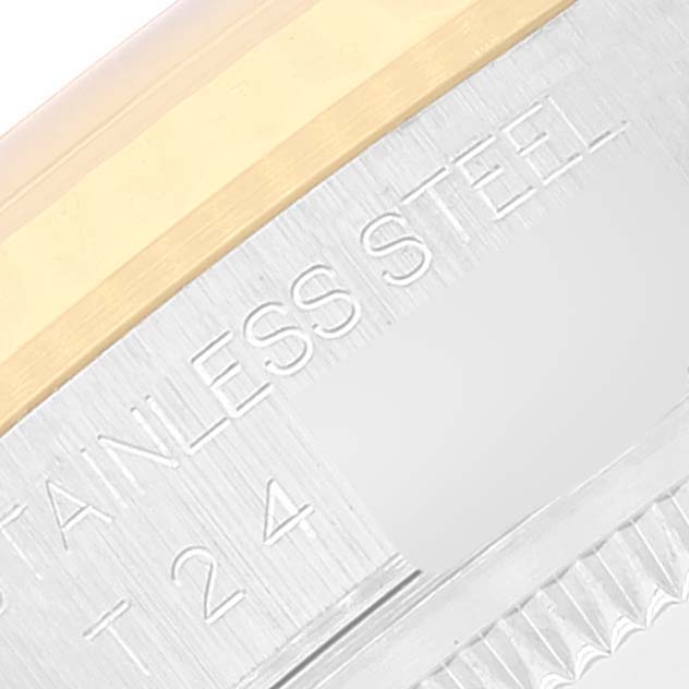 This close-up image shows the side of the case for a Rolex Datejust 16233 Men's Steel and Gold (two tone) Blue Dial 16233 Men's Steel and Gold (two tone) Blue Dial watch, highlighting the "STAINLESS STEEL" engraving.