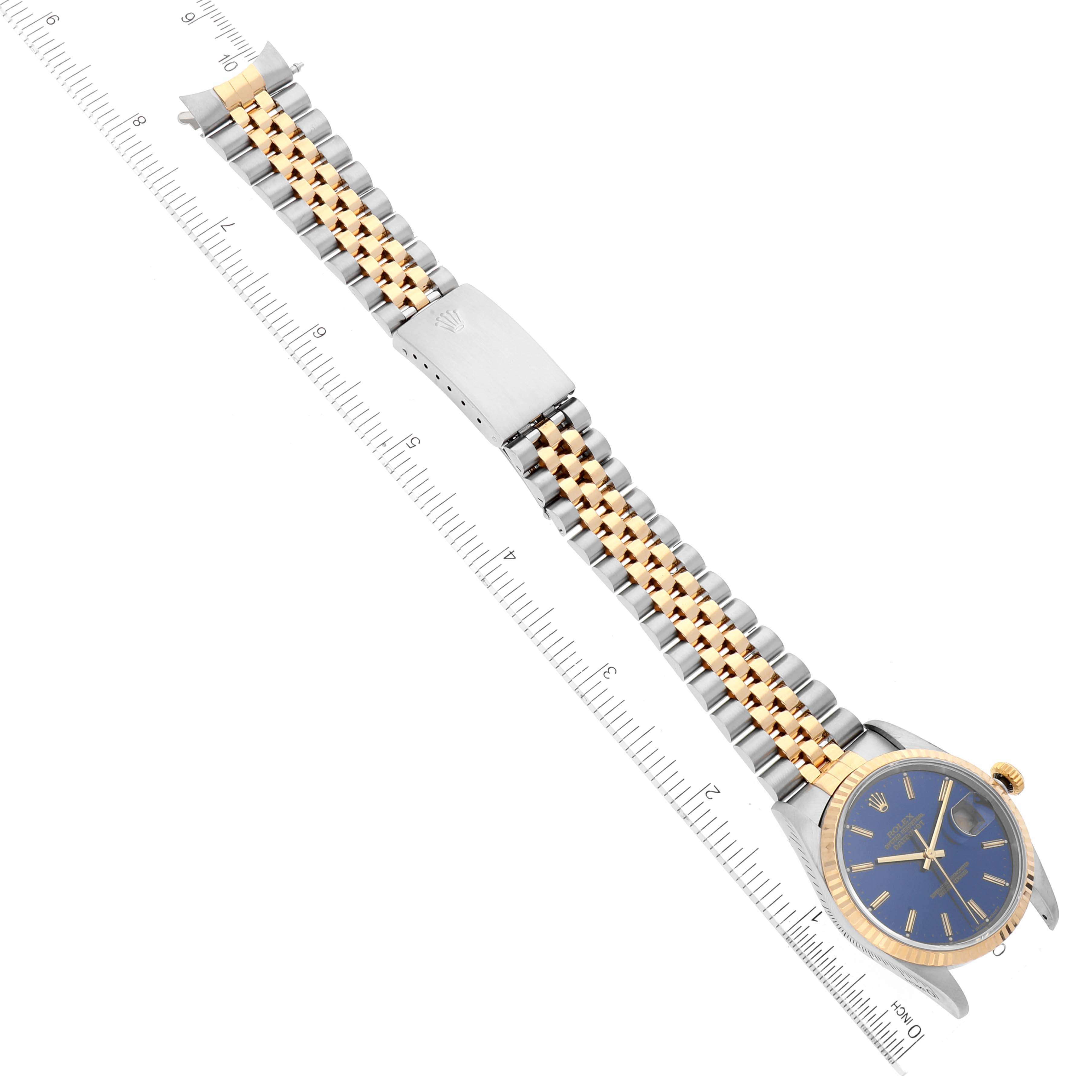 The image shows a top-down view of a Rolex Datejust 16233 Men's Steel and Gold (two tone) Blue Dial 16233 Men's Steel and Gold (two tone) Blue Dial watch, highlighting the dial, bezel, bracelet, and clasp.