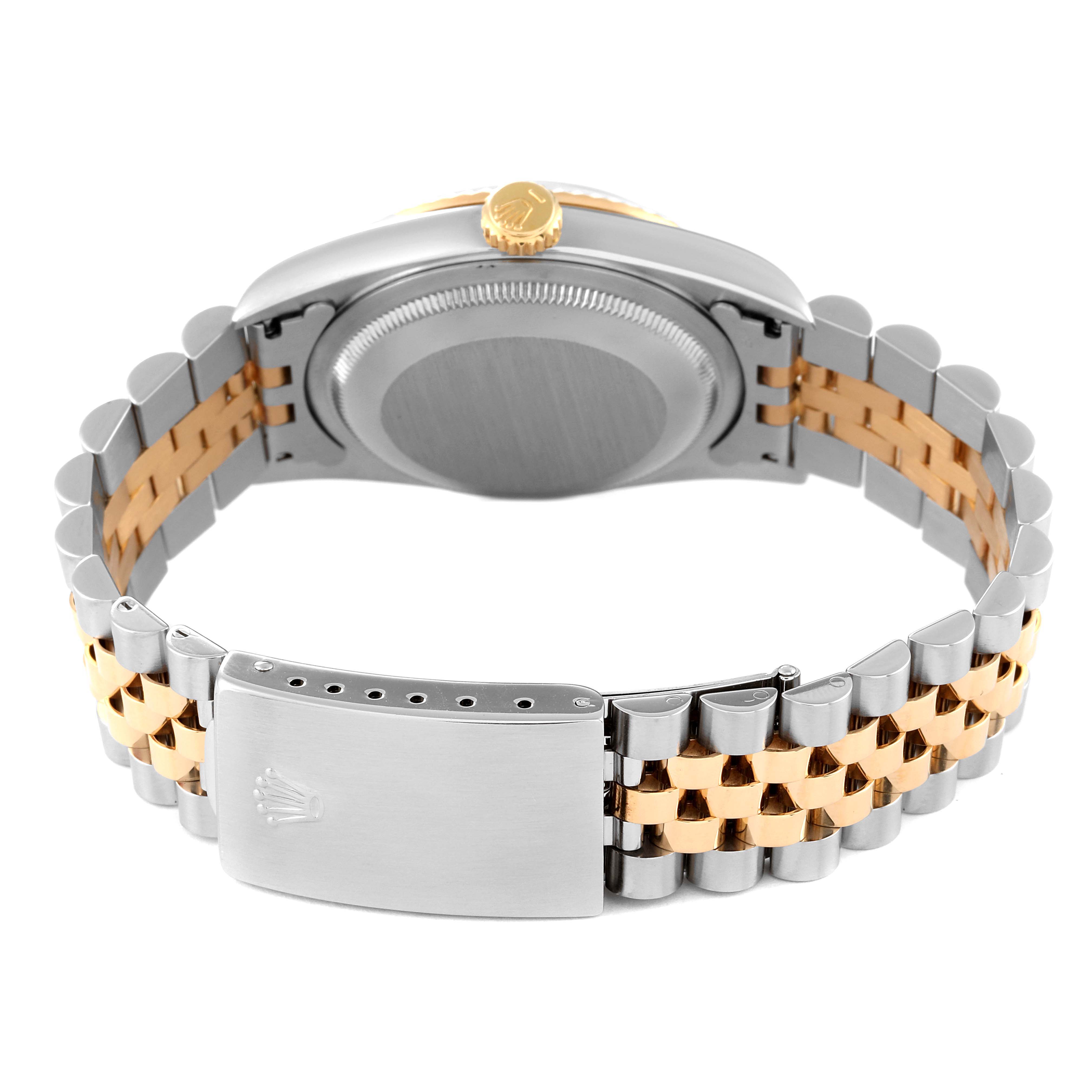 This is a Rolex Datejust 16233 Men's Steel and Gold (two tone) Blue Dial 16233 Men's Steel and Gold (two tone) Blue Dial watch shown from the back, highlighting its two-tone bracelet and clasp.