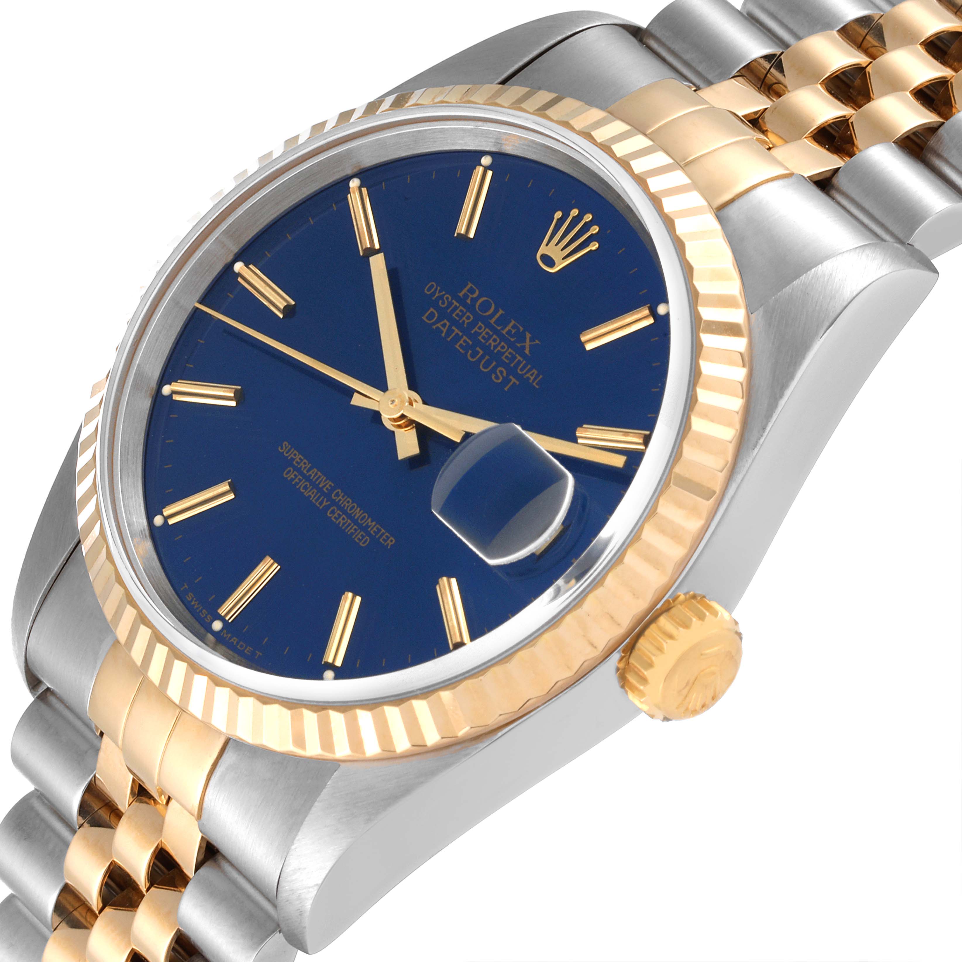 The Rolex Datejust 16233 Men's Steel and Gold (two tone) Blue Dial 16233 Men's Steel and Gold (two tone) Blue Dial watch is shown at a slight angle, highlighting its blue dial, gold markers, cyclops date, fluted bezel, and two-tone bracelet.