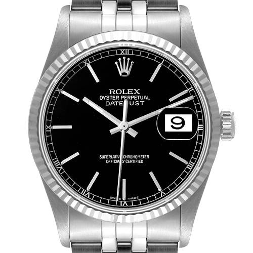 The image shows a frontal view of a Rolex Datejust watch, highlighting its black dial, date window, and fluted bezel.