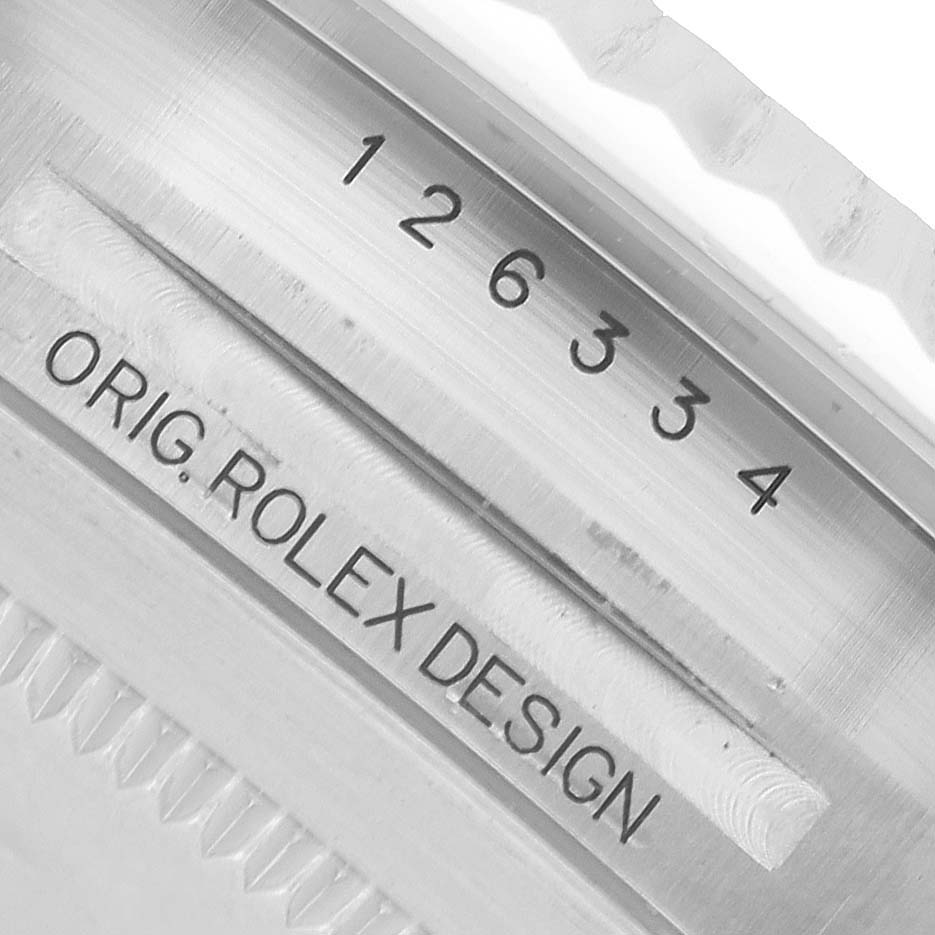 The image shows a close-up of the inner case engraving of a Rolex Datejust 41 126334 Men's Stainless Steel Green Dial, featuring the model number and "ORIG. ROLEX DESIGN."