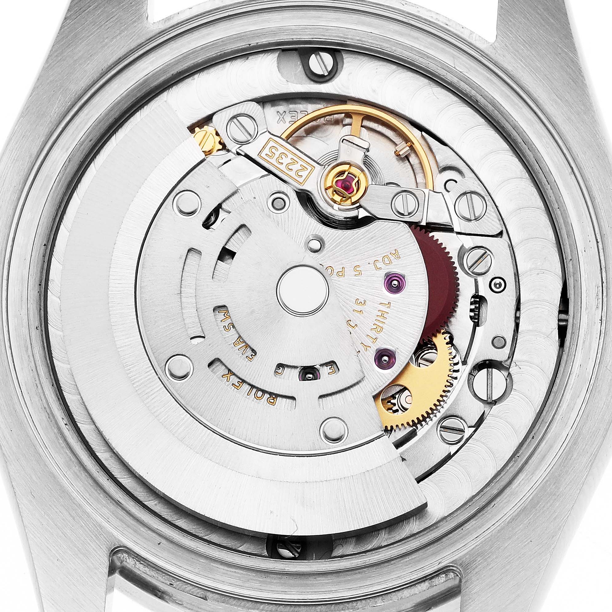 The image shows the movement of a Rolex Datejust 178384 Women
s Stainless Steel Mother of Pearl Dial watch from a top-down angle, highlighting its intricate gears and rotor.