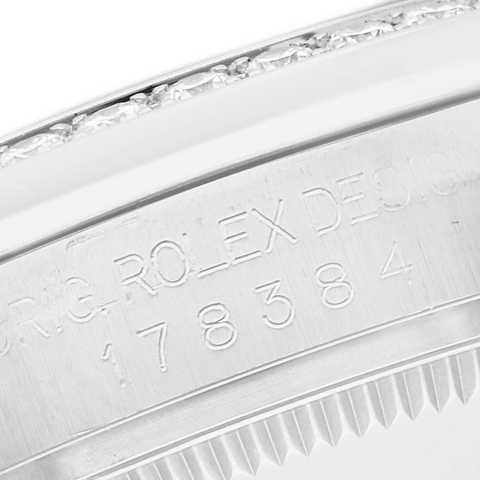The image shows the side engraving of a Rolex Datejust 178384 Women
s Stainless Steel Mother of Pearl Dial watch, focusing on the serial number and case edge.