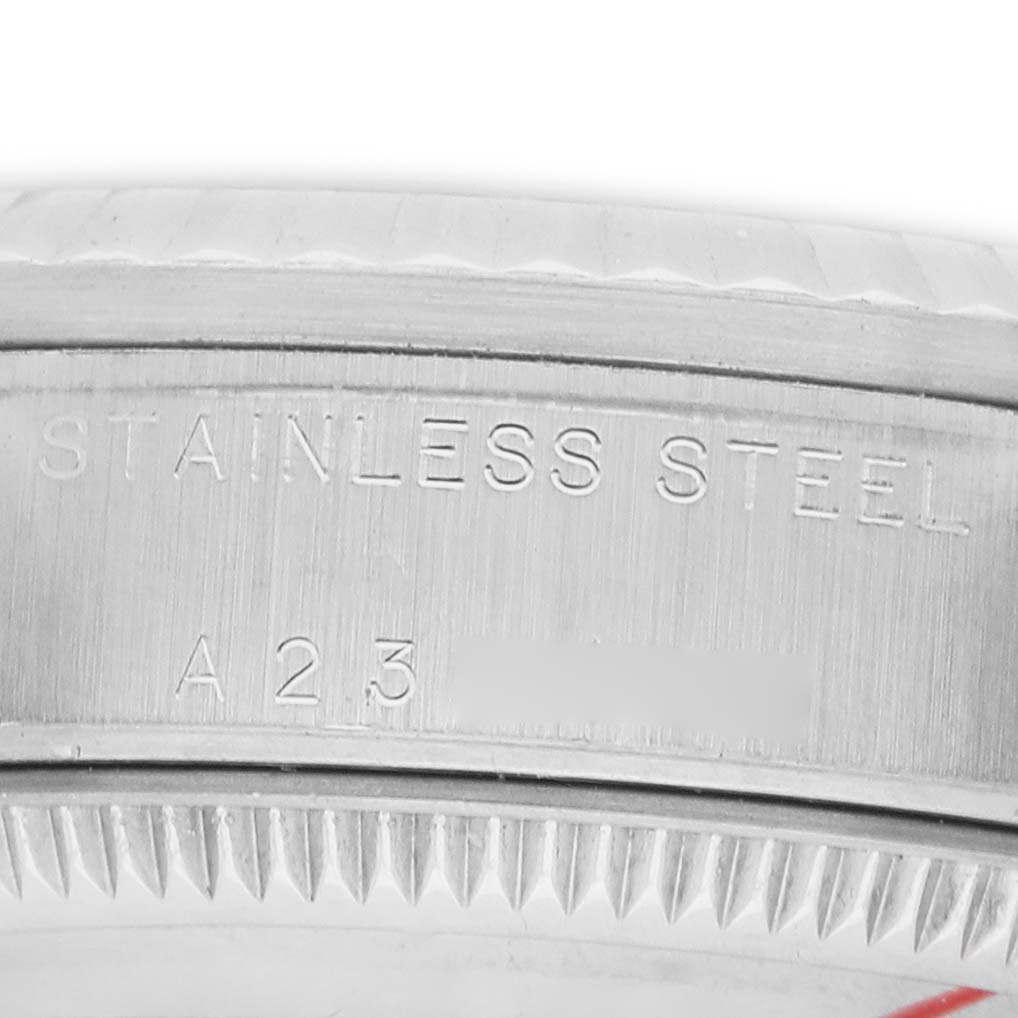 The image shows a close-up of the side and back of a Rolex Mid-Size 178274 Women's Stainless Steel White Dial watch, highlighting the stainless steel engraving.