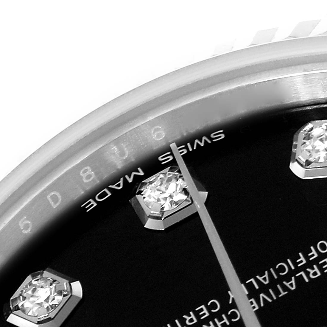 This image shows a detailed close-up of the dial and diamond markers on a Mid-Size Rolex watch.