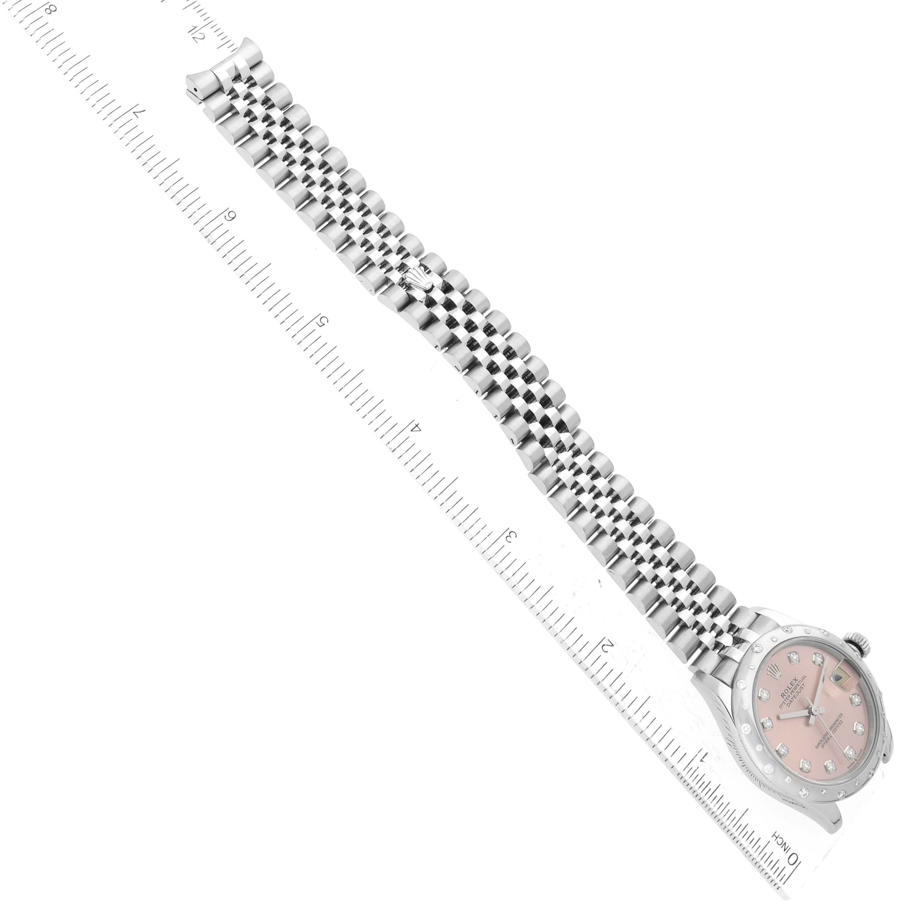 The image shows a Rolex Datejust 278344 Women's Stainless Steel Pink Dial 278344 Women's Stainless Steel Pink Dial watch laid flat on a ruler, displaying the face and metal bracelet.