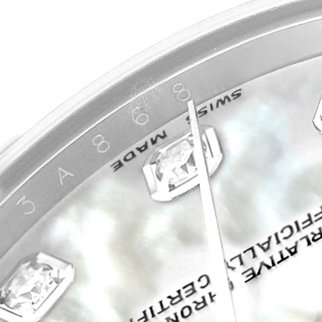 The image shows a close-up of the dial edge, markers, and hands of a Rolex President 178159 Women
s White Gold Mother of Pearl Dial watch with visible "8" numeral and text.