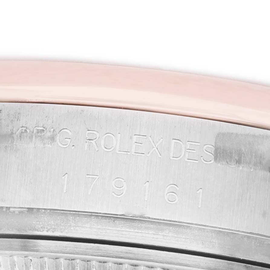 The image shows a close-up of the side of a Rolex Datejust 179161 Women's Stainless Steel White Dial watch case, displaying engraved model details.