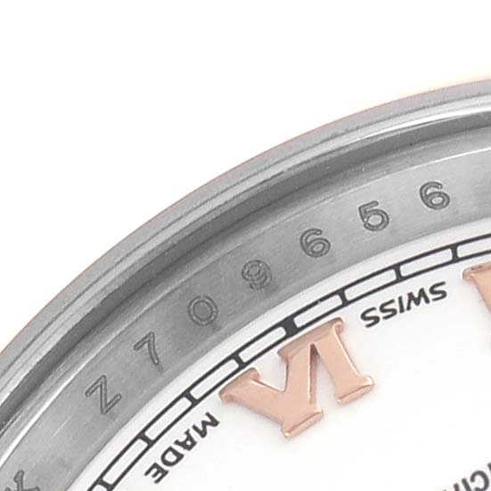 The image shows an angled close-up of the Rolex Datejust 179161 Women's Stainless Steel White Dial watch's dial and bezel, highlighting the Roman numeral "VI."
