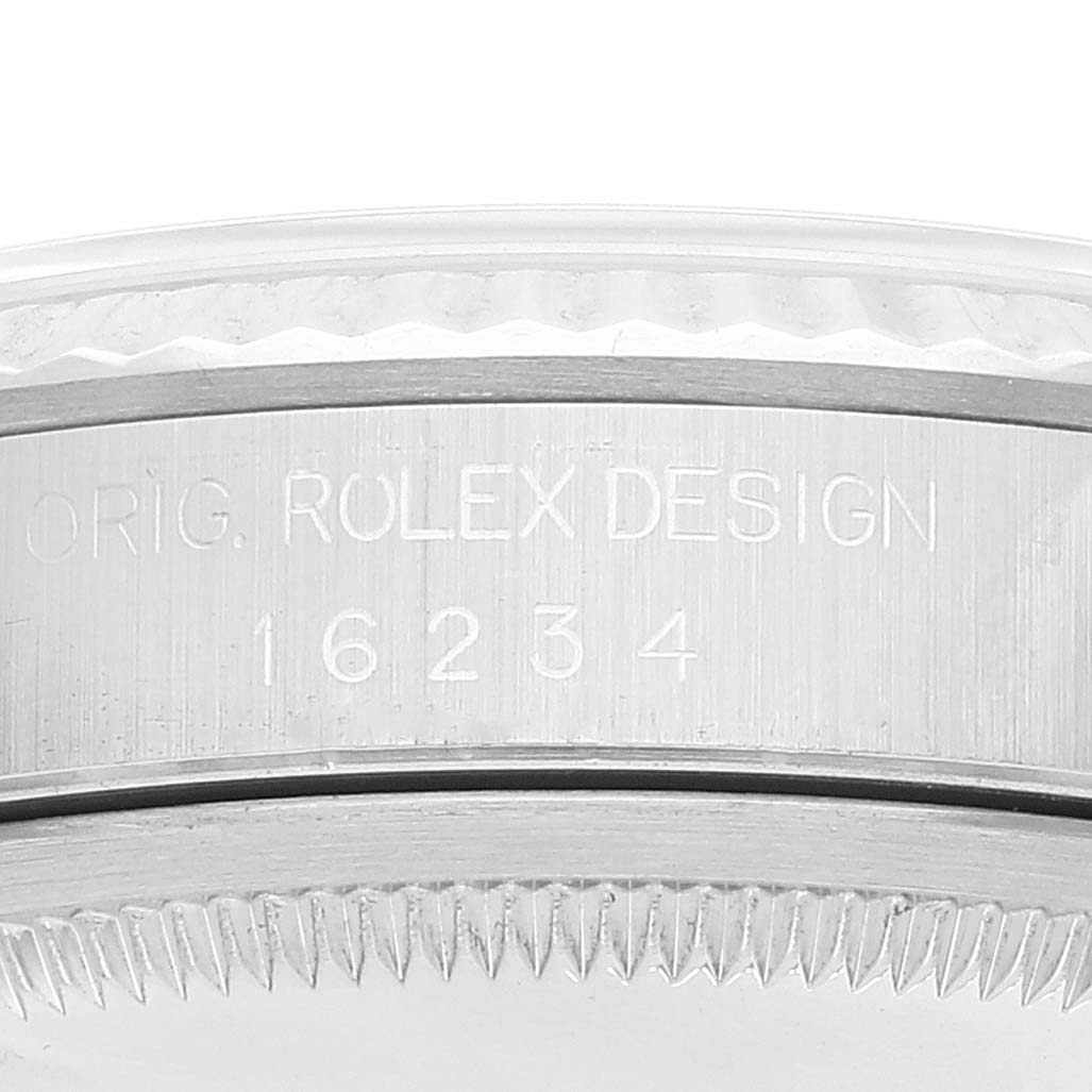 The image shows a close-up of the engraving on the side of the Rolex Datejust 16234 Men's Stainless Steel Silver Dial 16234 Men's Stainless Steel Silver Dial model, revealing its reference number.